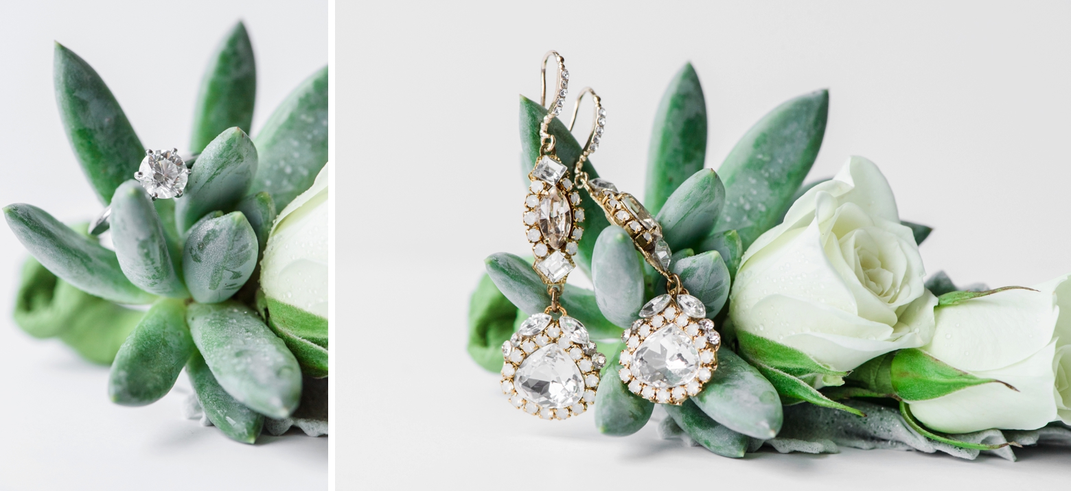 Bridal earrings and wedding ring on succulents and white roses