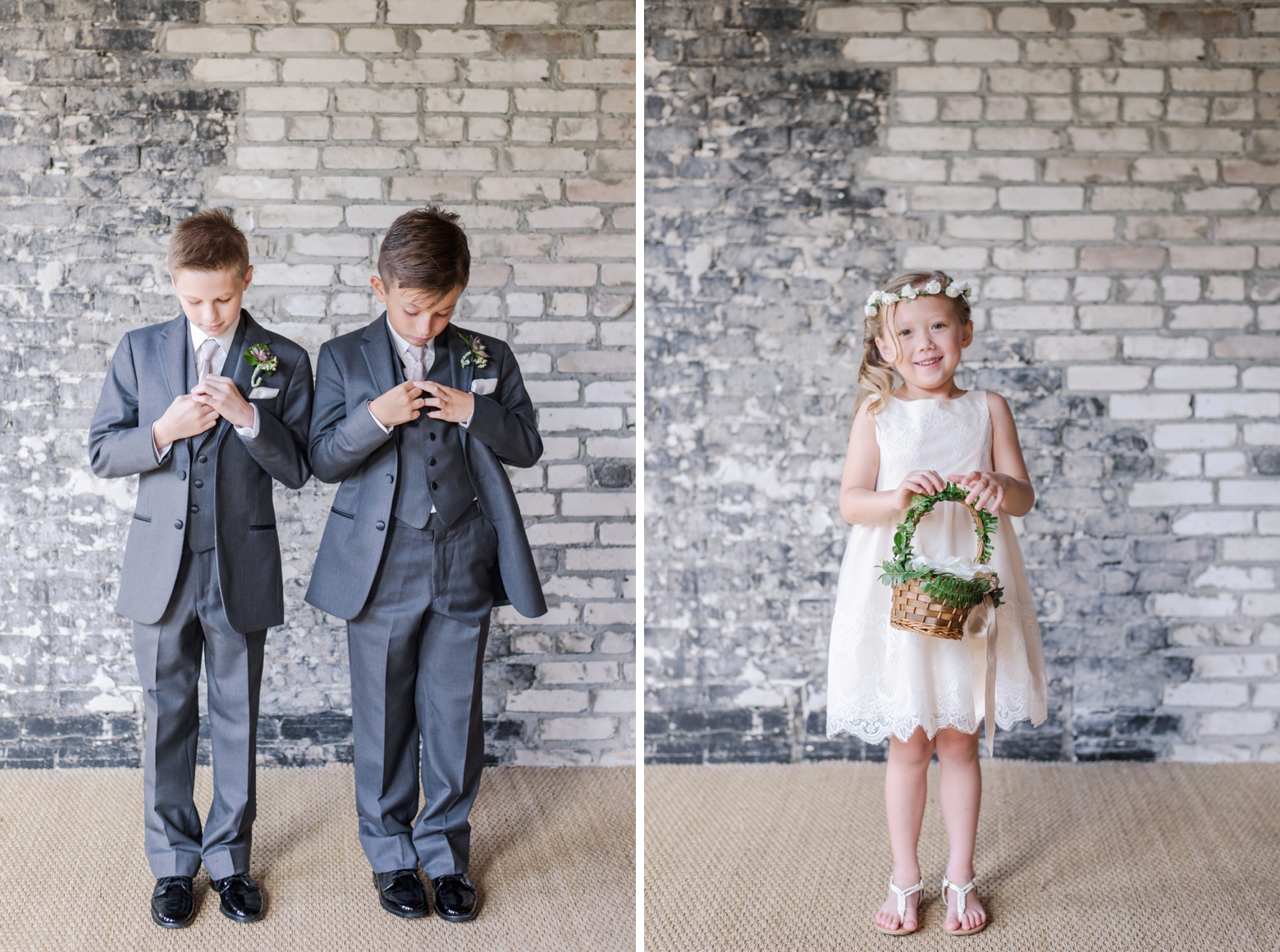 The two ring bearers and the flower girl against an old brick wall