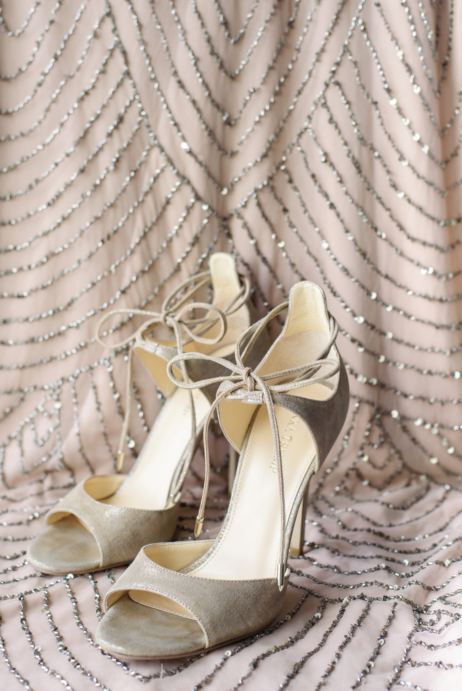 The Bride's shoes against an art deco designed dress by Sarah and Ben Photography