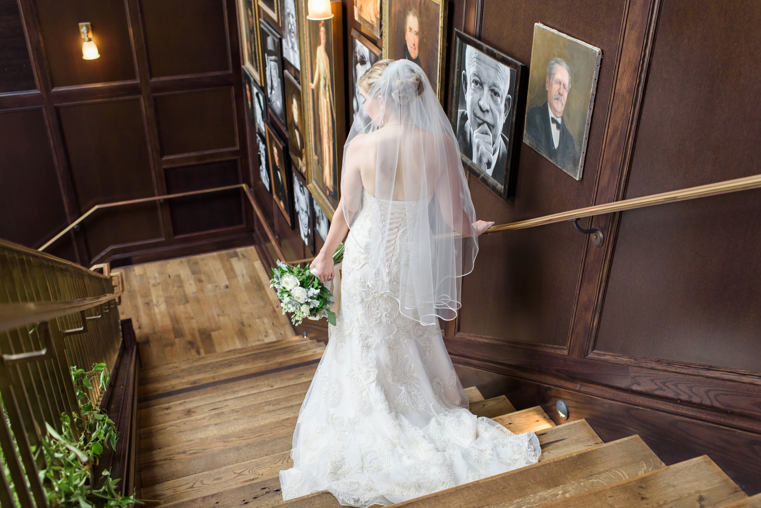 The Bride descends the designed portrait staircase of Oxford Exchange