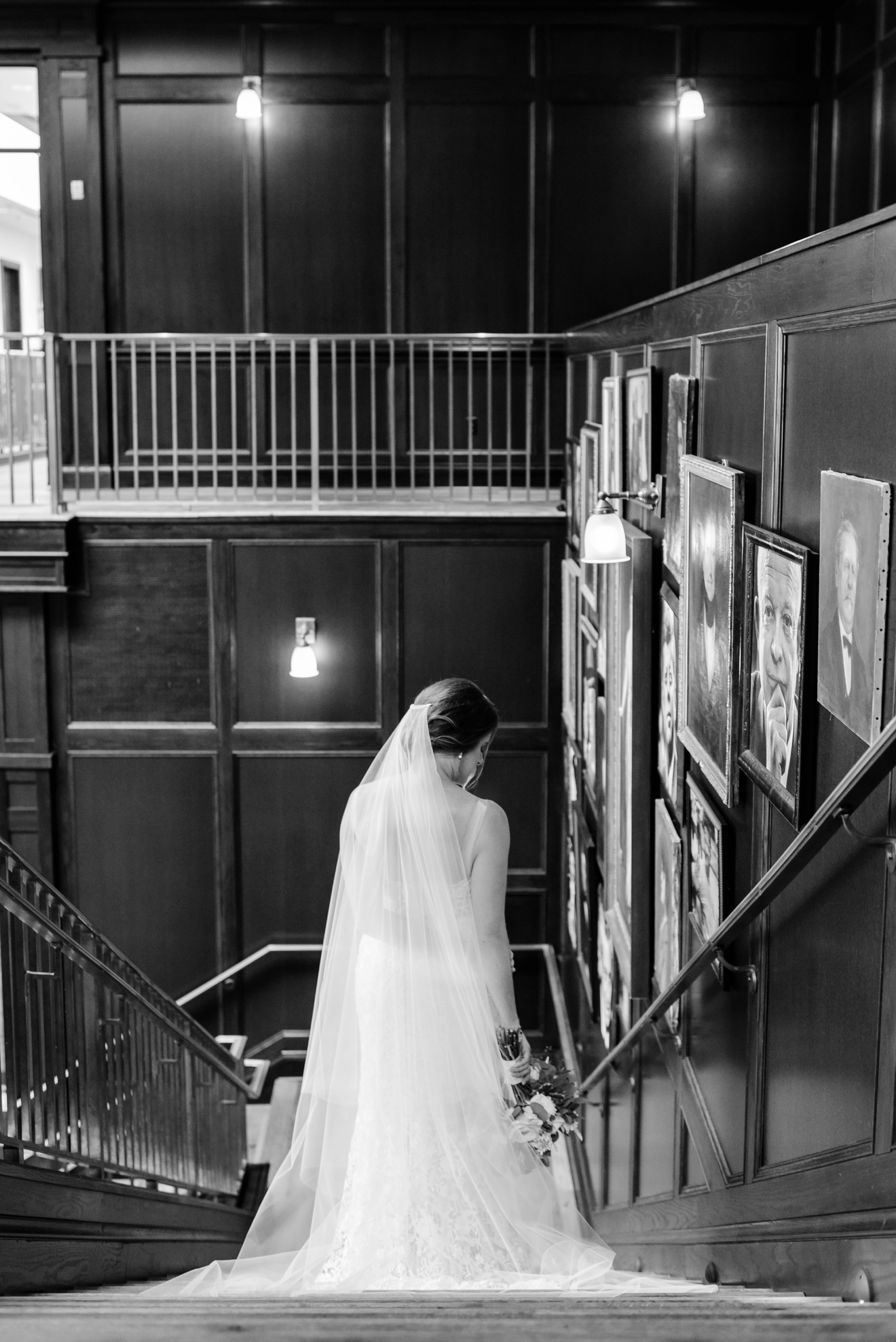 A classic shot of a bride walking down the staircase of Oxford Exchange 