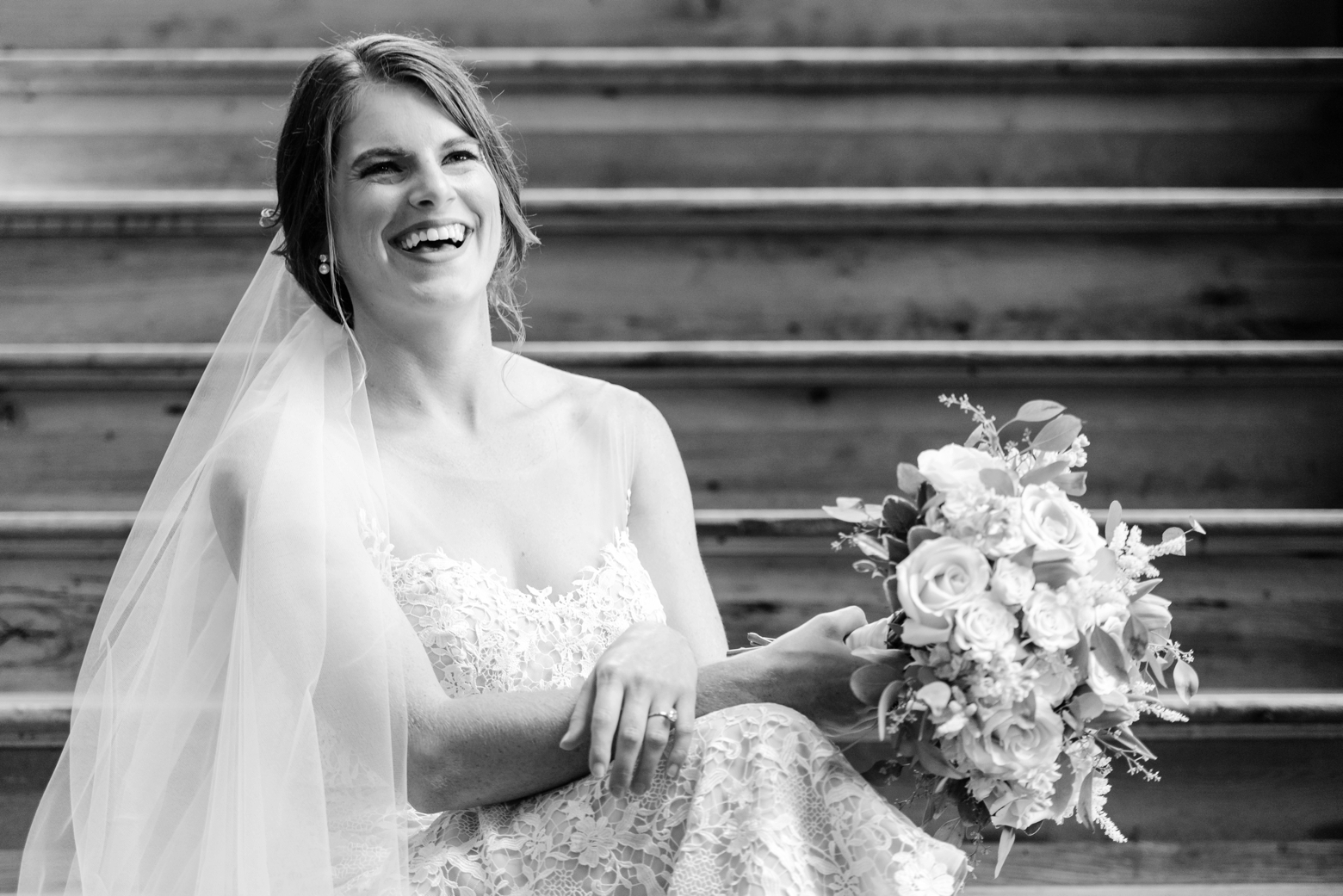 A bride laughs during her bridal session at Oxford Exchange