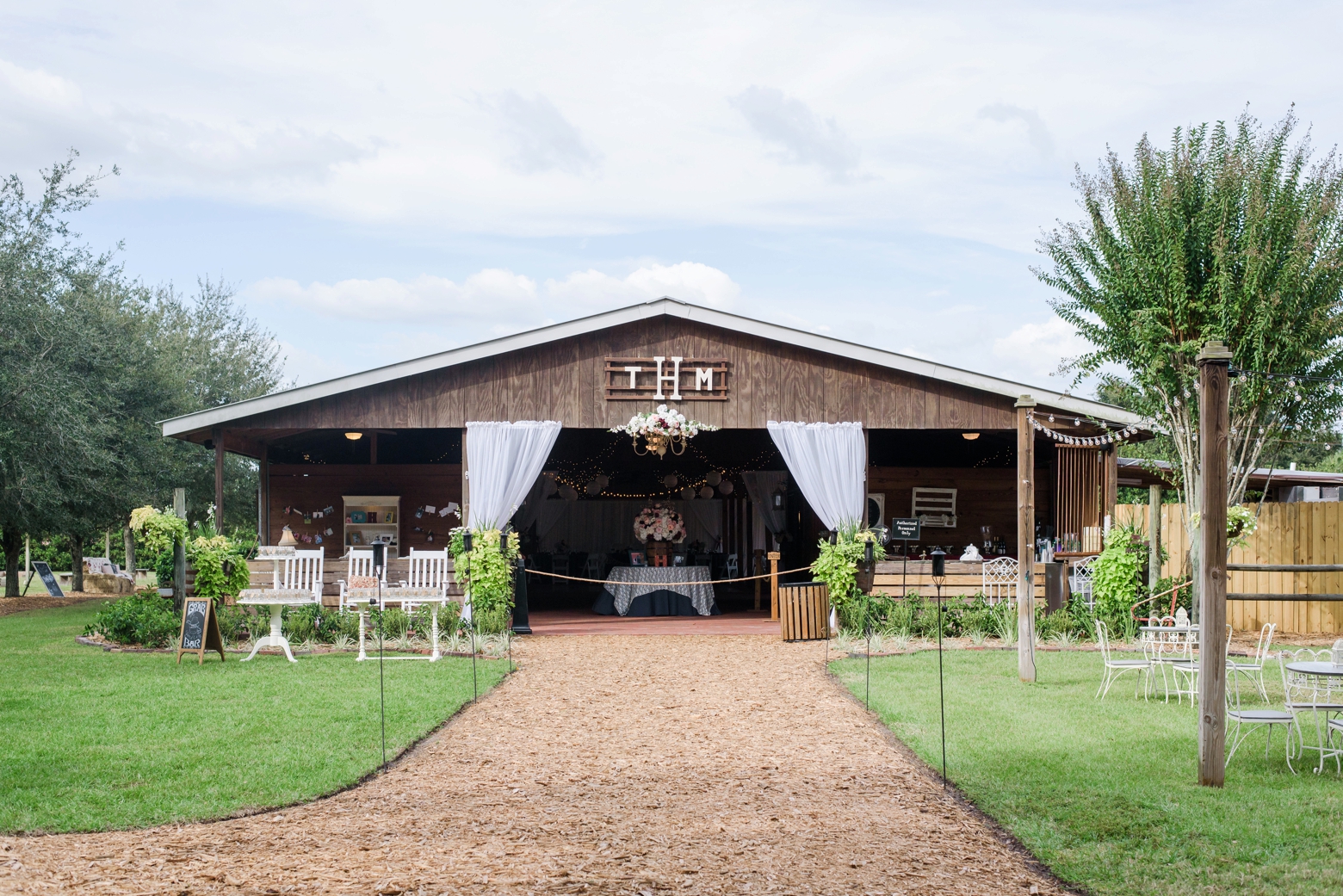 The barn where the reception will be held with custom monogram of the Bride and Grooms initials