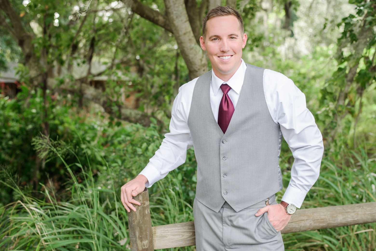 The Groom poses against a simple fence before his Cross Creek Ranch Wedding day in Rural, FL