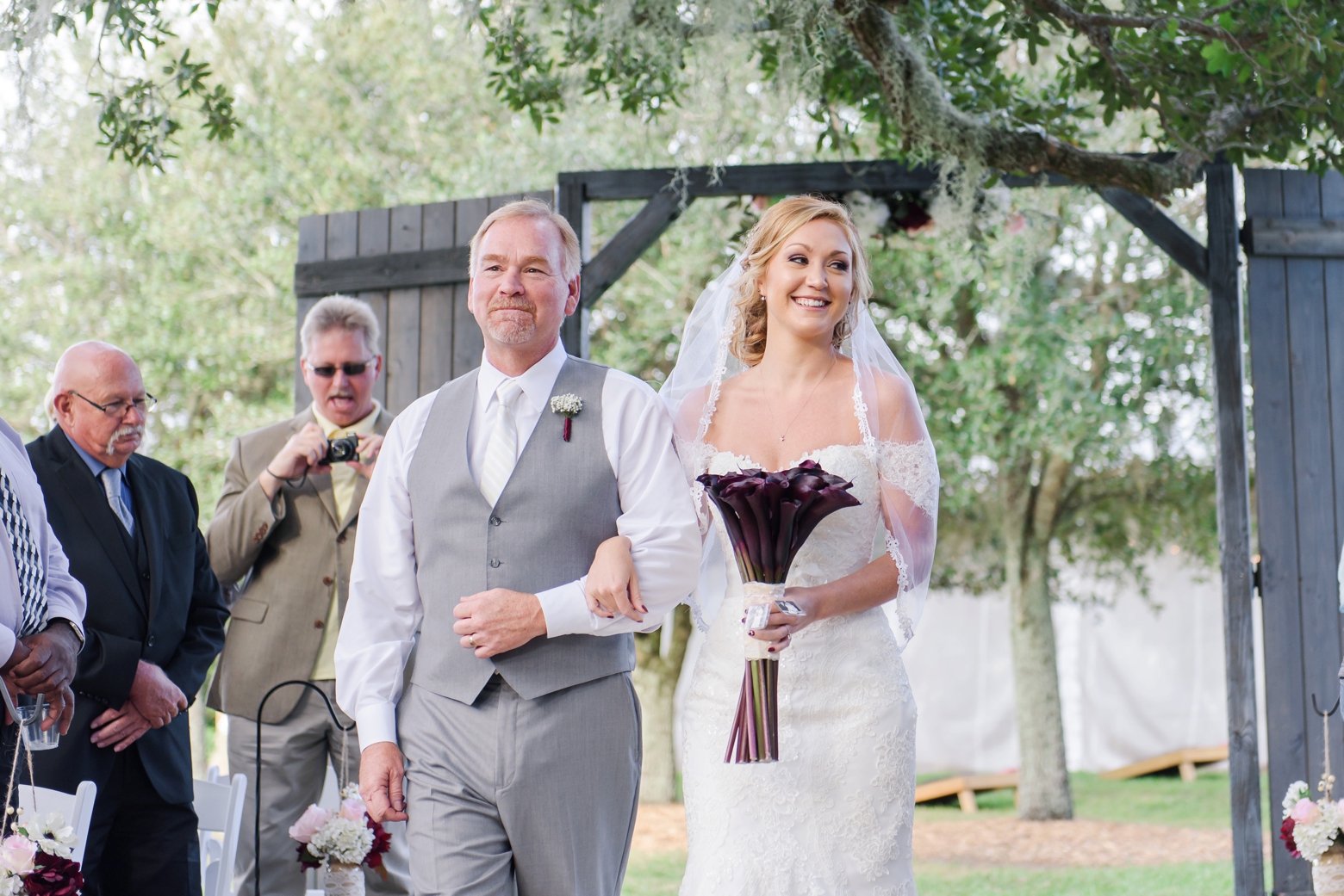 The Bride and her Dad walking the Aisle during Her Cross Creek Ranch wedding day