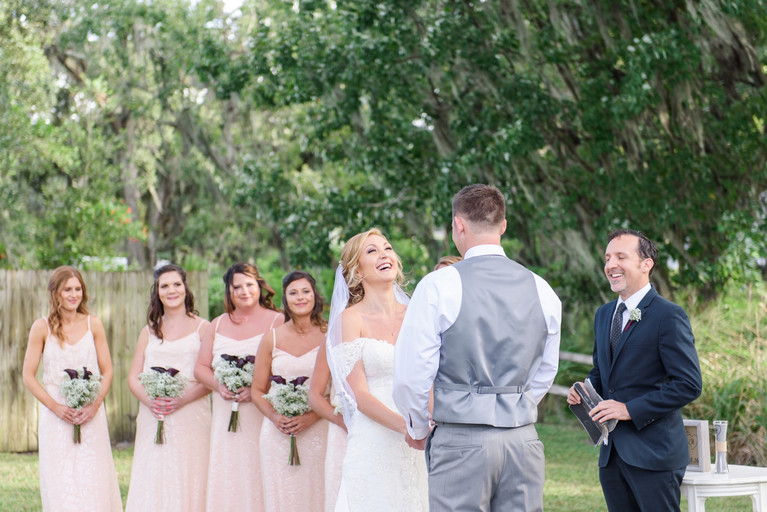 Bride laughs during the vows between her and her Groom