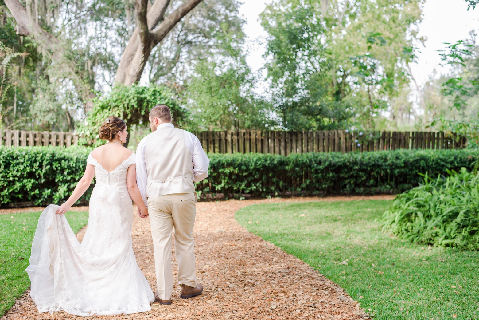 Bride and Groom walking together to their cross creek wedding ceremony