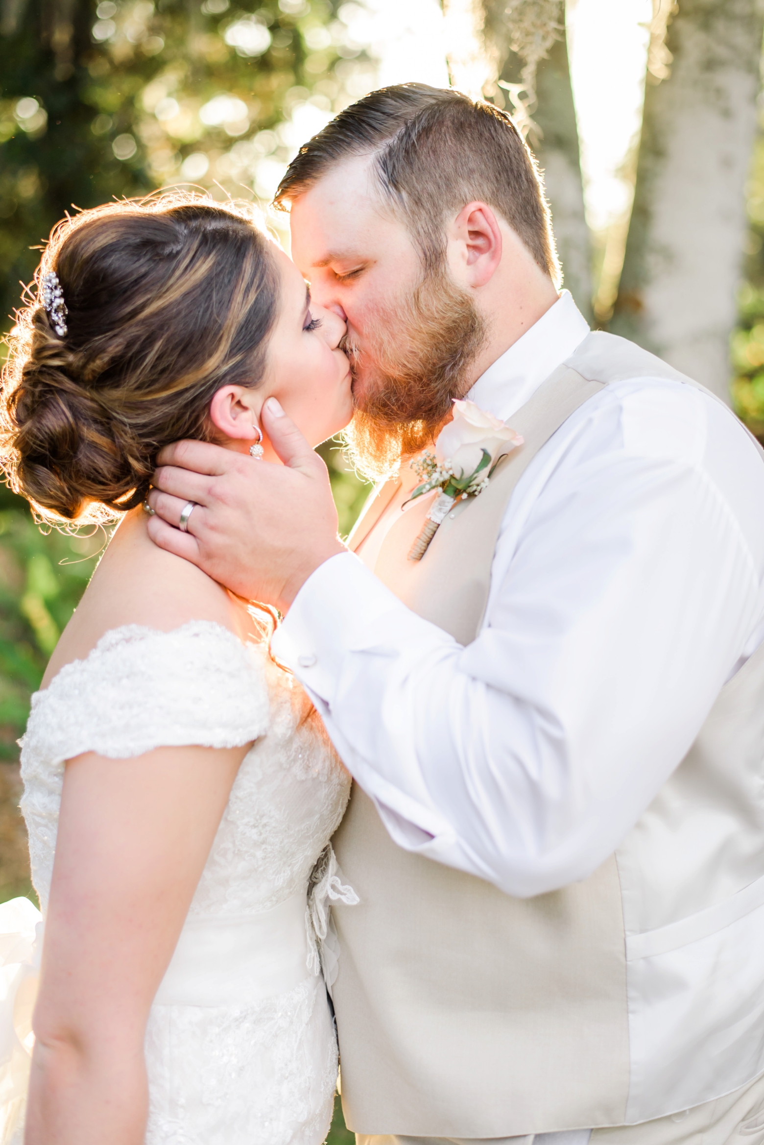 Bride and Groom sharing a kiss in the golden hour of their wedding day in Florida