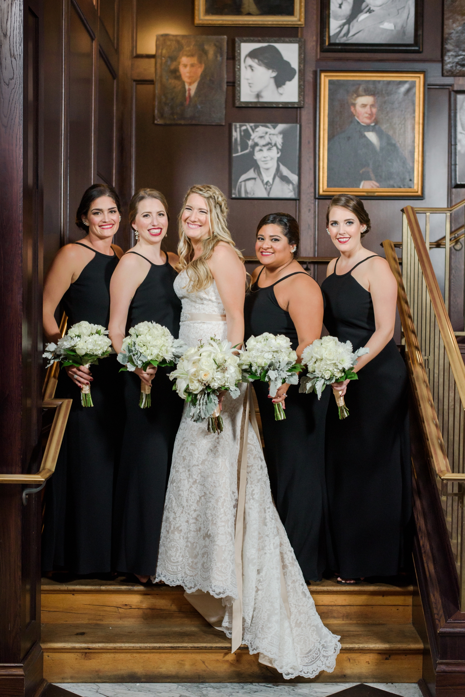 Bride and her Bridesmaids psoe for a formal photo on the steps before her Oxford Exchange wedding