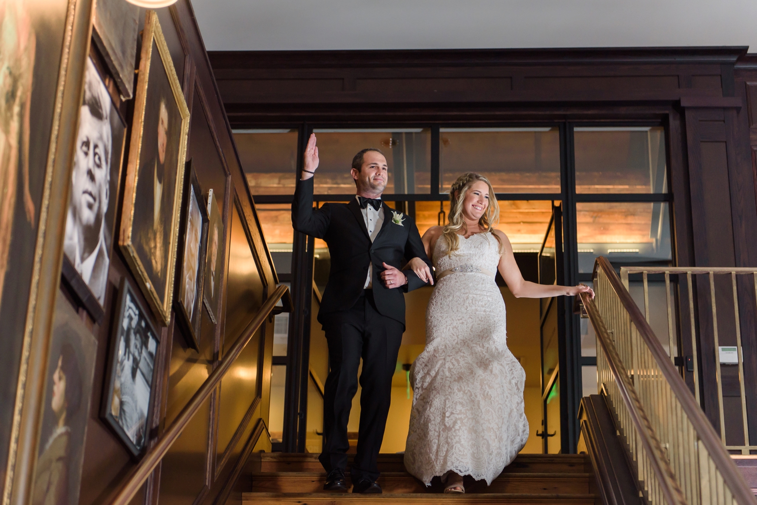 Bride and Groom descend a staircase in Tampa on their oxford exchange wedding day