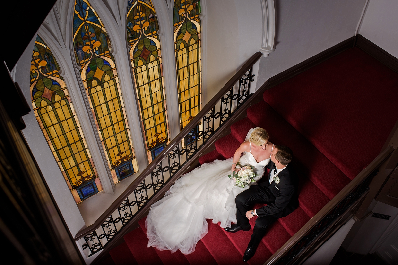 Bride and Groom on the steps of the church