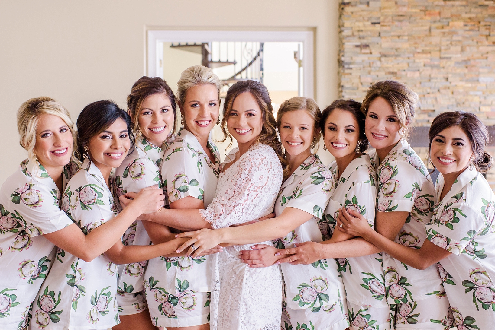 Bride and her bridesmaids in their matching robes
