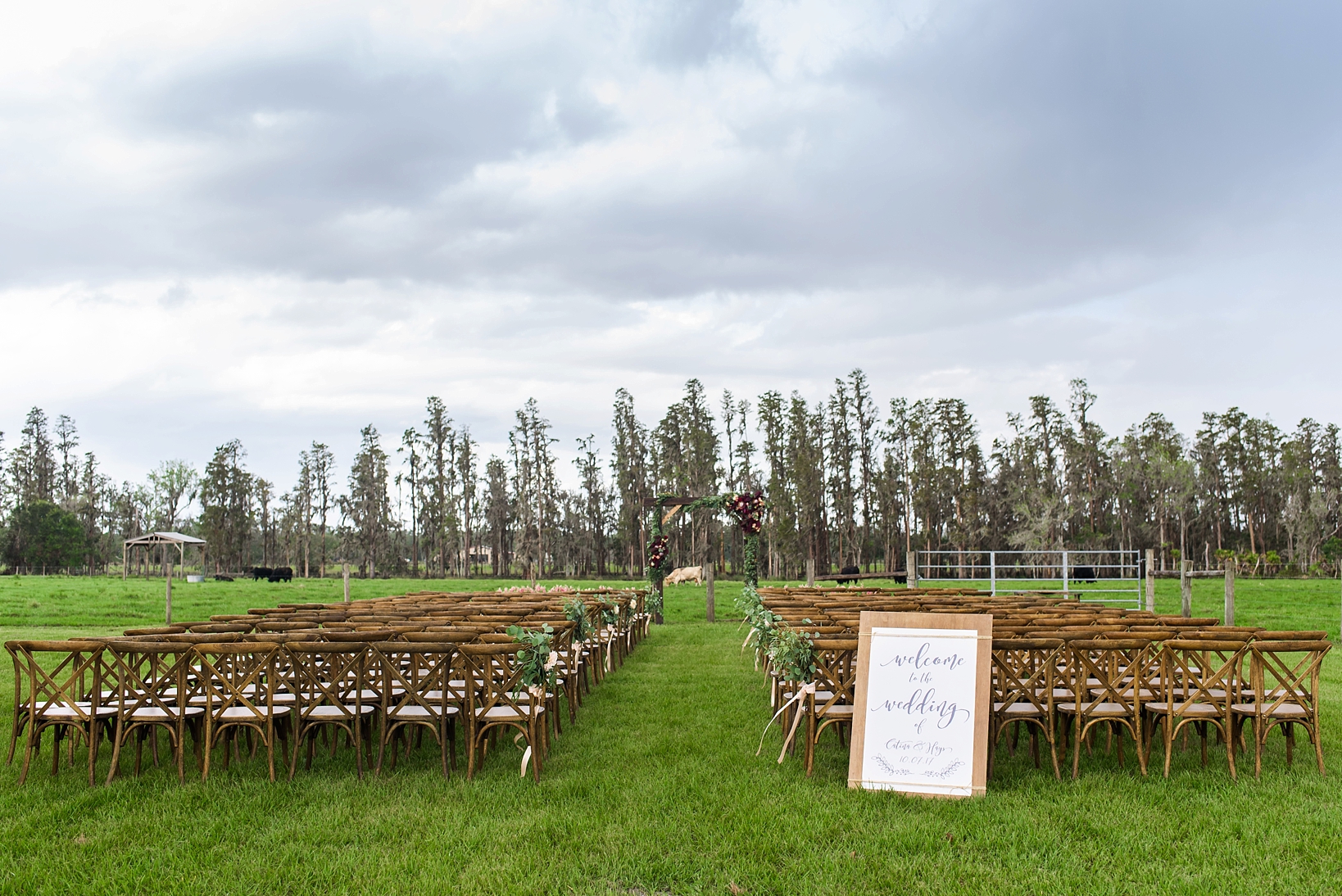Ceremony space on a private ranch with custom wedding arch