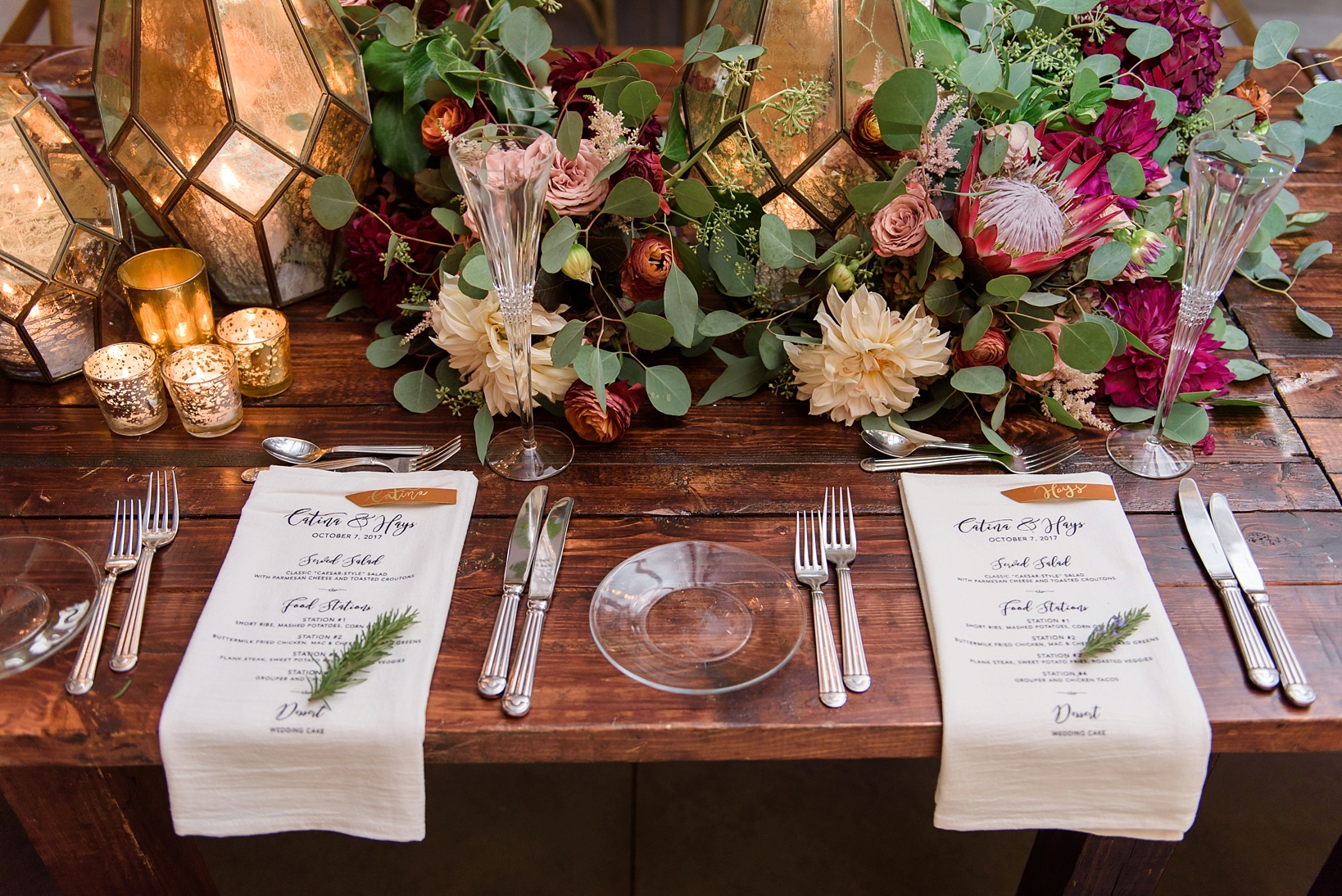 close-up of the table decor including champagne flutes and leather name markers
