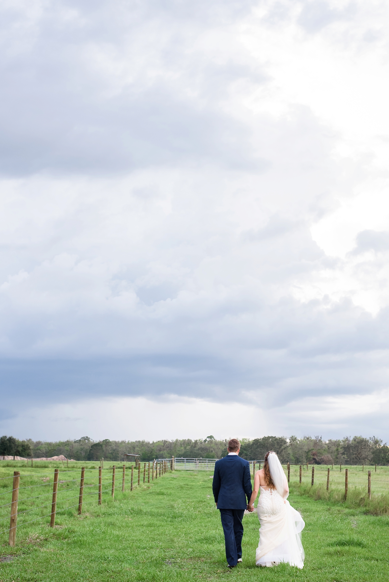 Bride and Groom surrounded by rain clouds in central florida