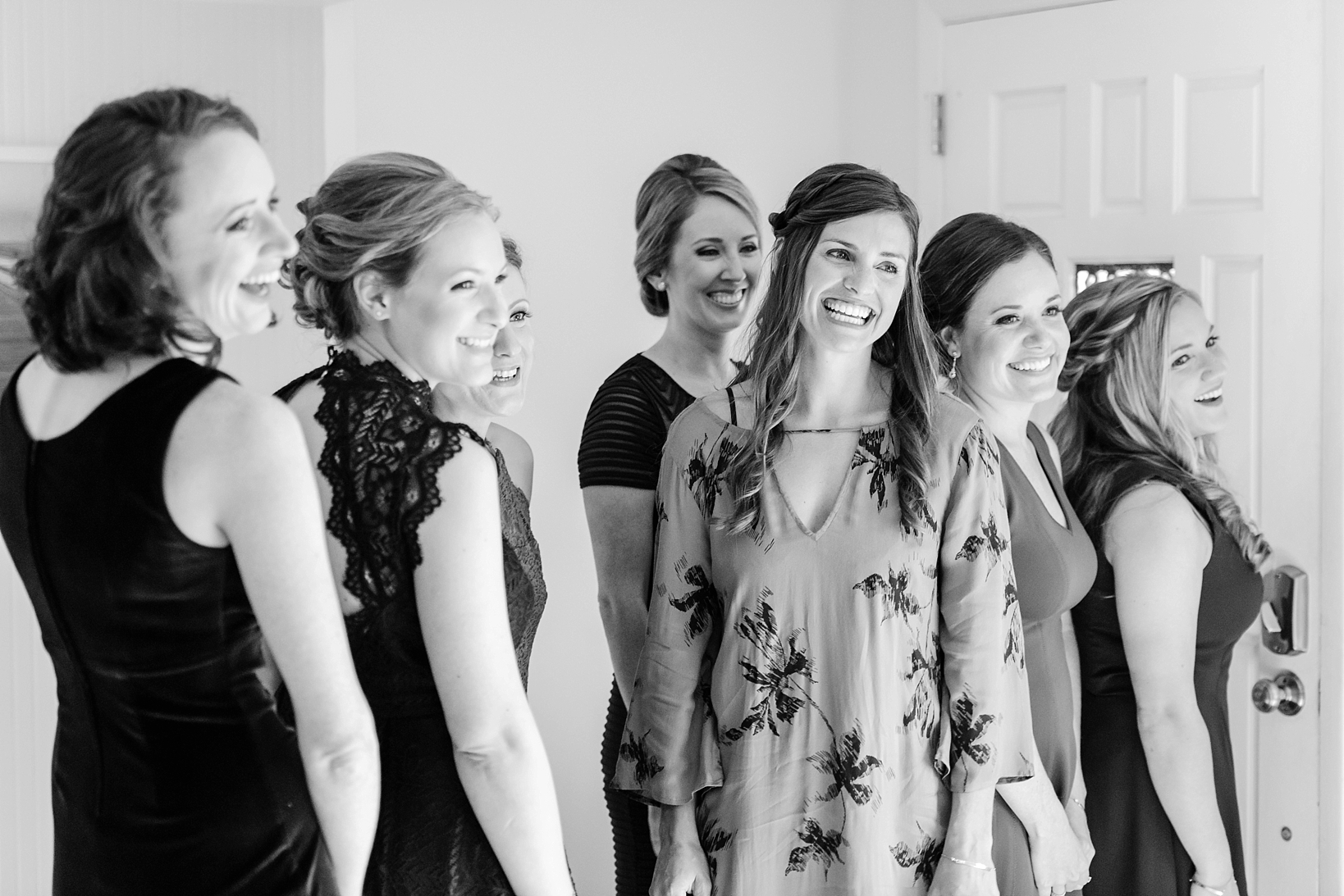 bridesmaids react to seeing the bride for the first time in her dress