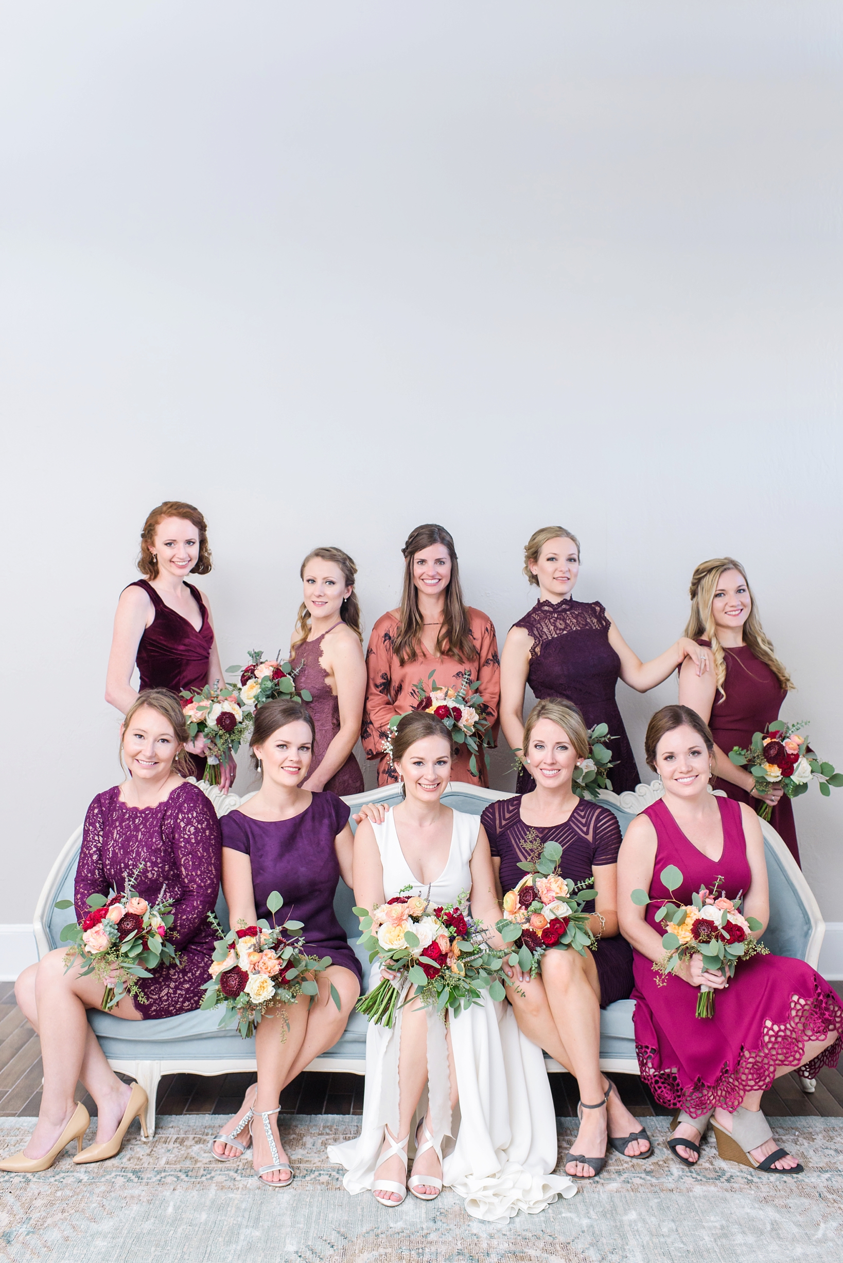 Formal picture of the bride and her bridesmaids seated