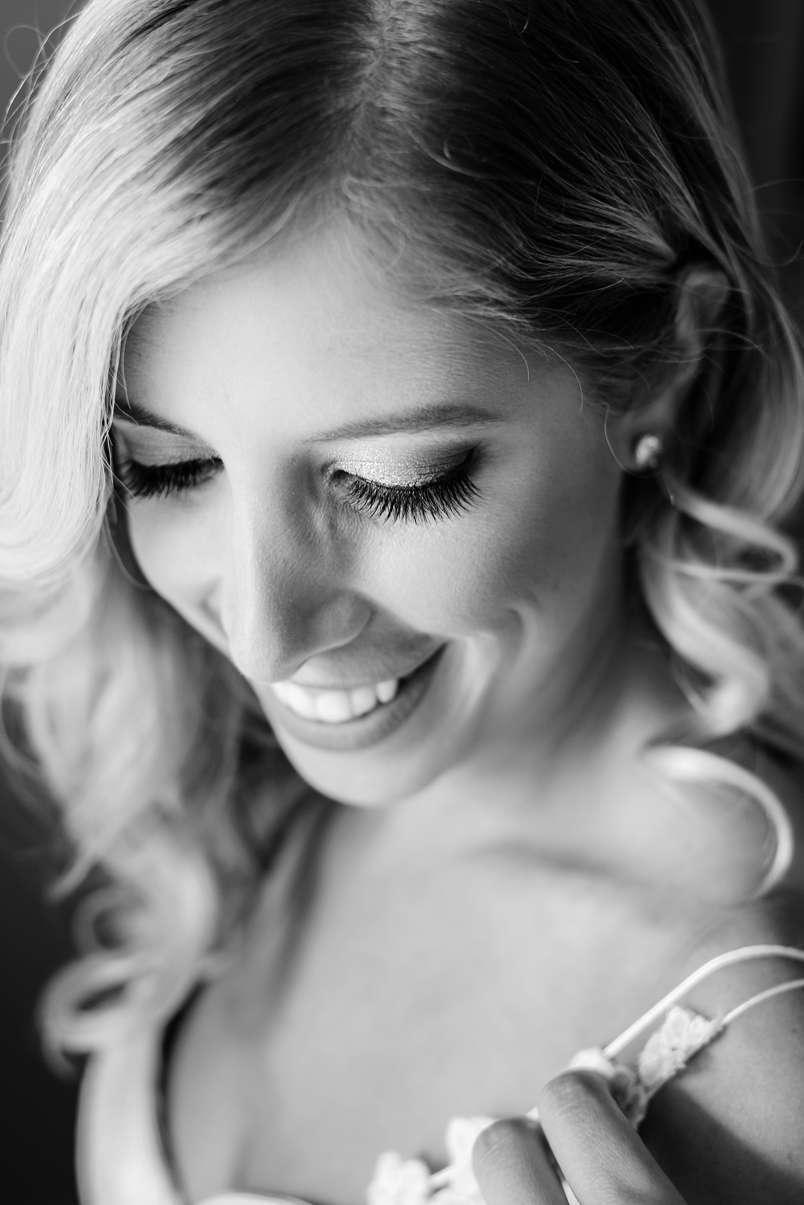 Black and white image of a bride smiling