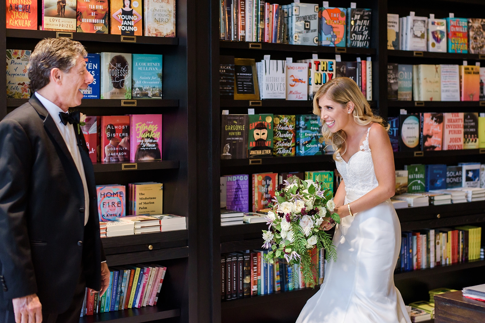 Father of the Bride sees his girl for the first time in her wedding dress in the library of Oxford Exchange