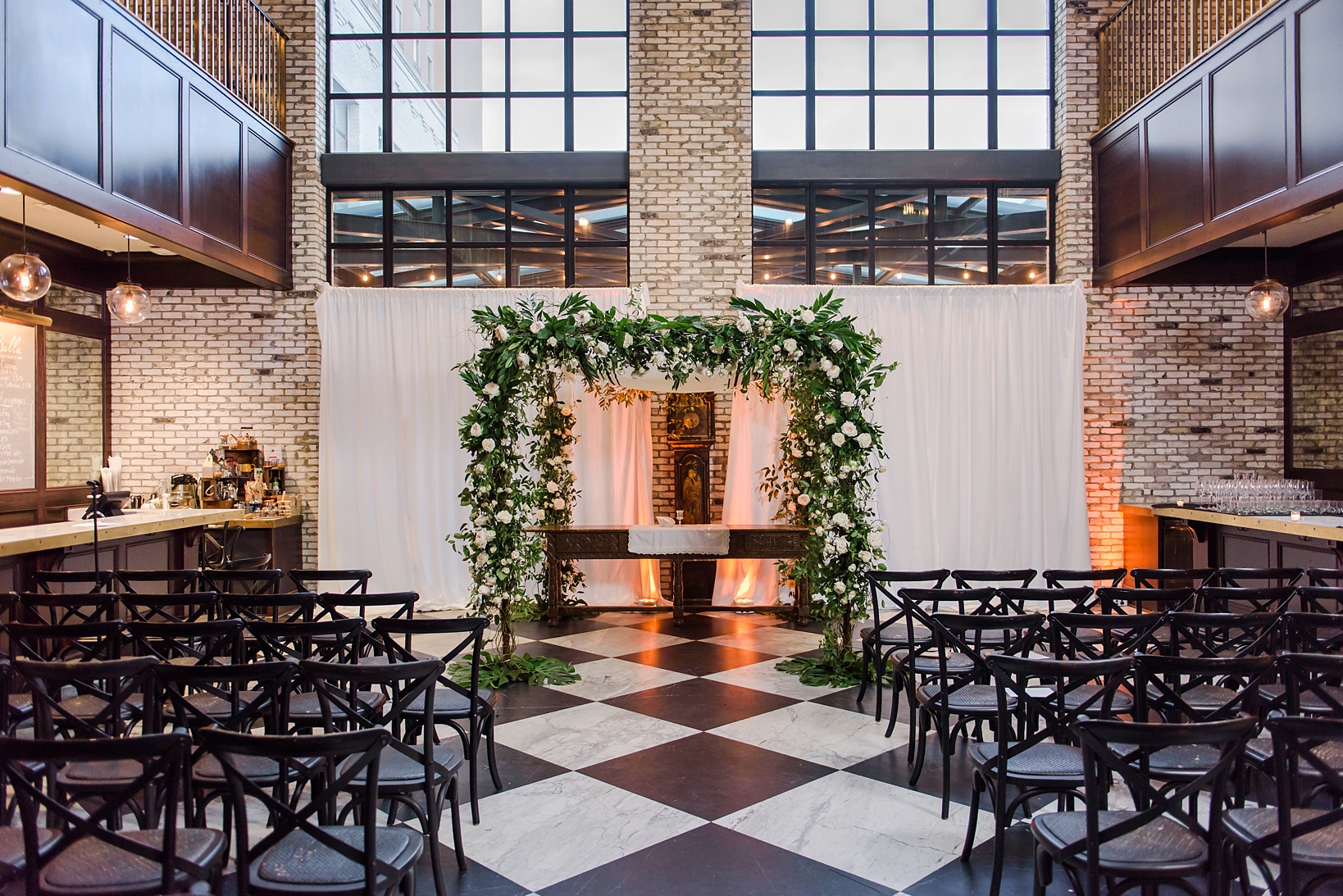 The huppah covered in florals at the Oxford Exchange in Tampa, FL