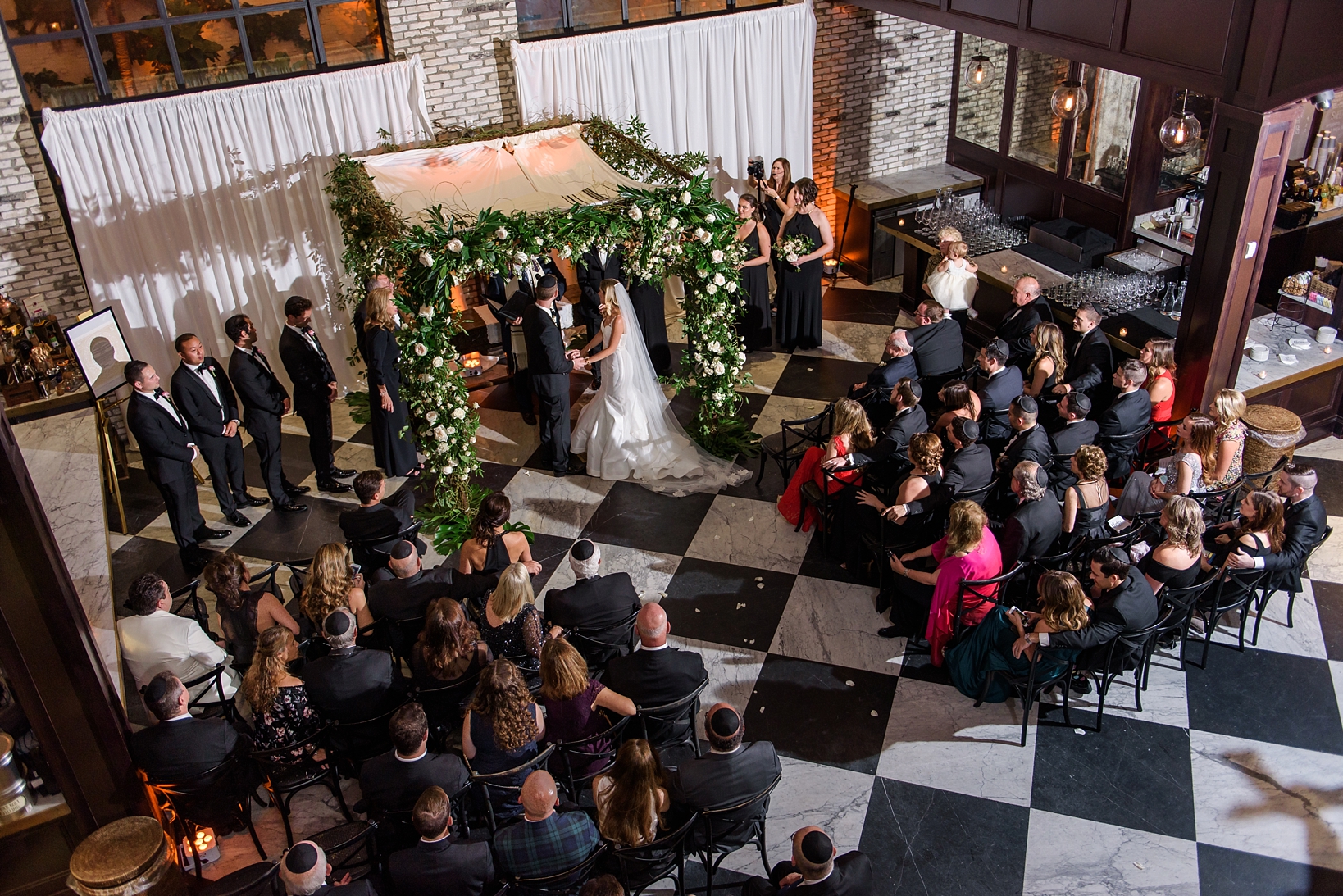 Bird's eye view of the ceremony and guests from a wedding at the Oxford Exchange in Tampa,FL