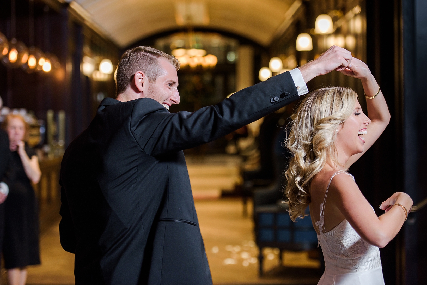The Groom spins his Wife during their first dance on their wedding day