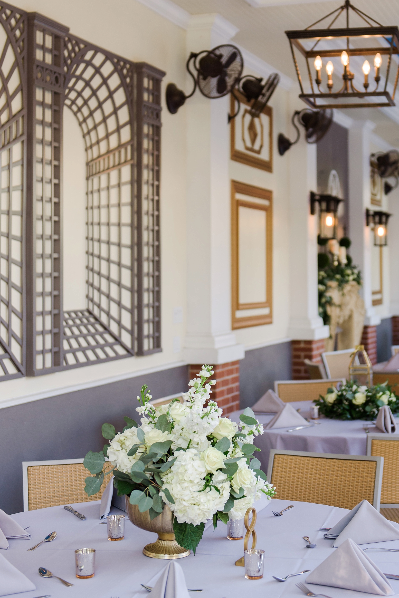 Reception decor including florals and 3D wall patterns