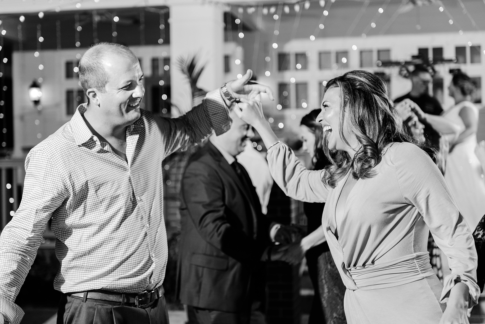 Black and White image of a couple dancing during the reception
