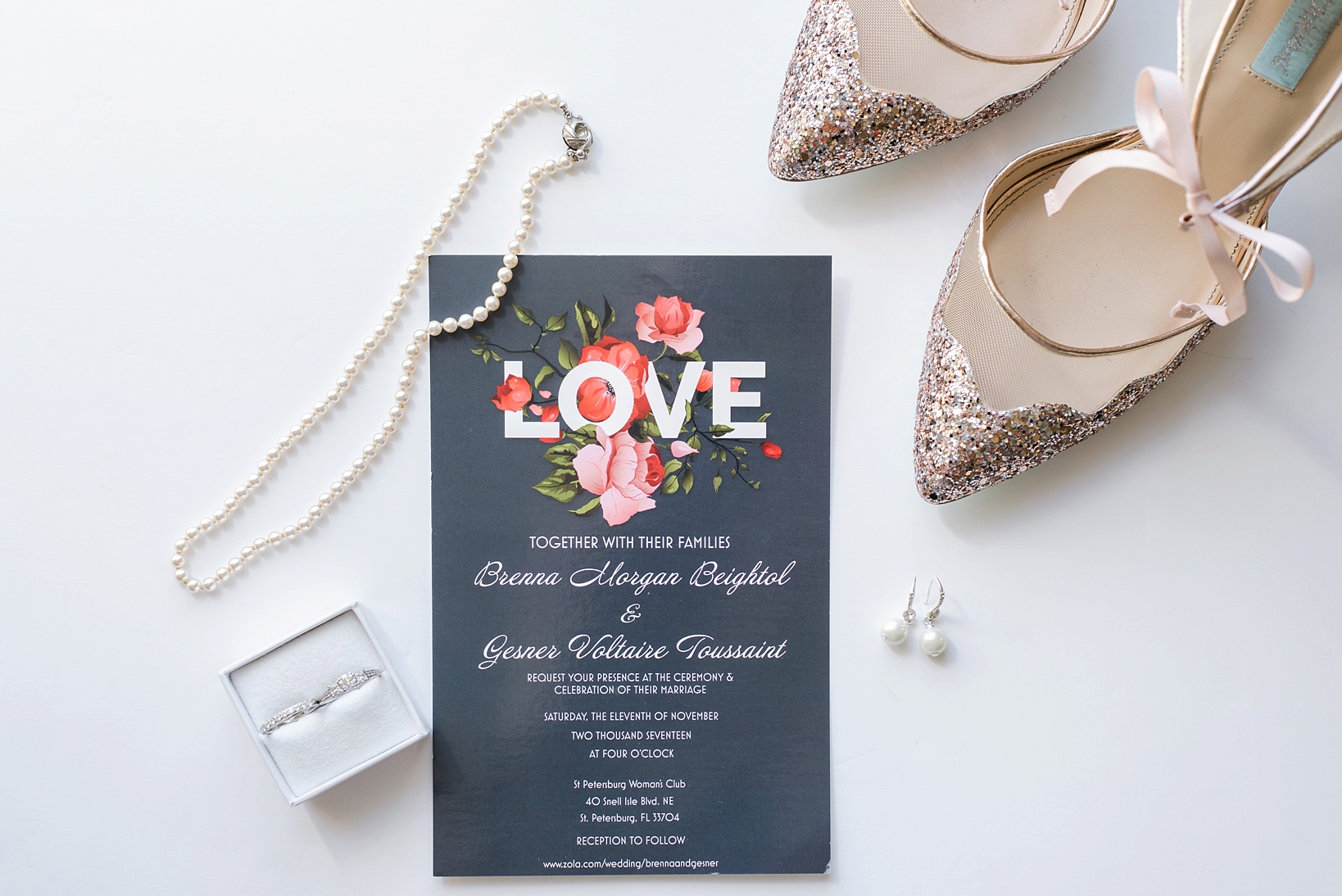 Wedding invitation with bridal details such as pearl necklace, earrings, rings and Betsy Johnson Shoes