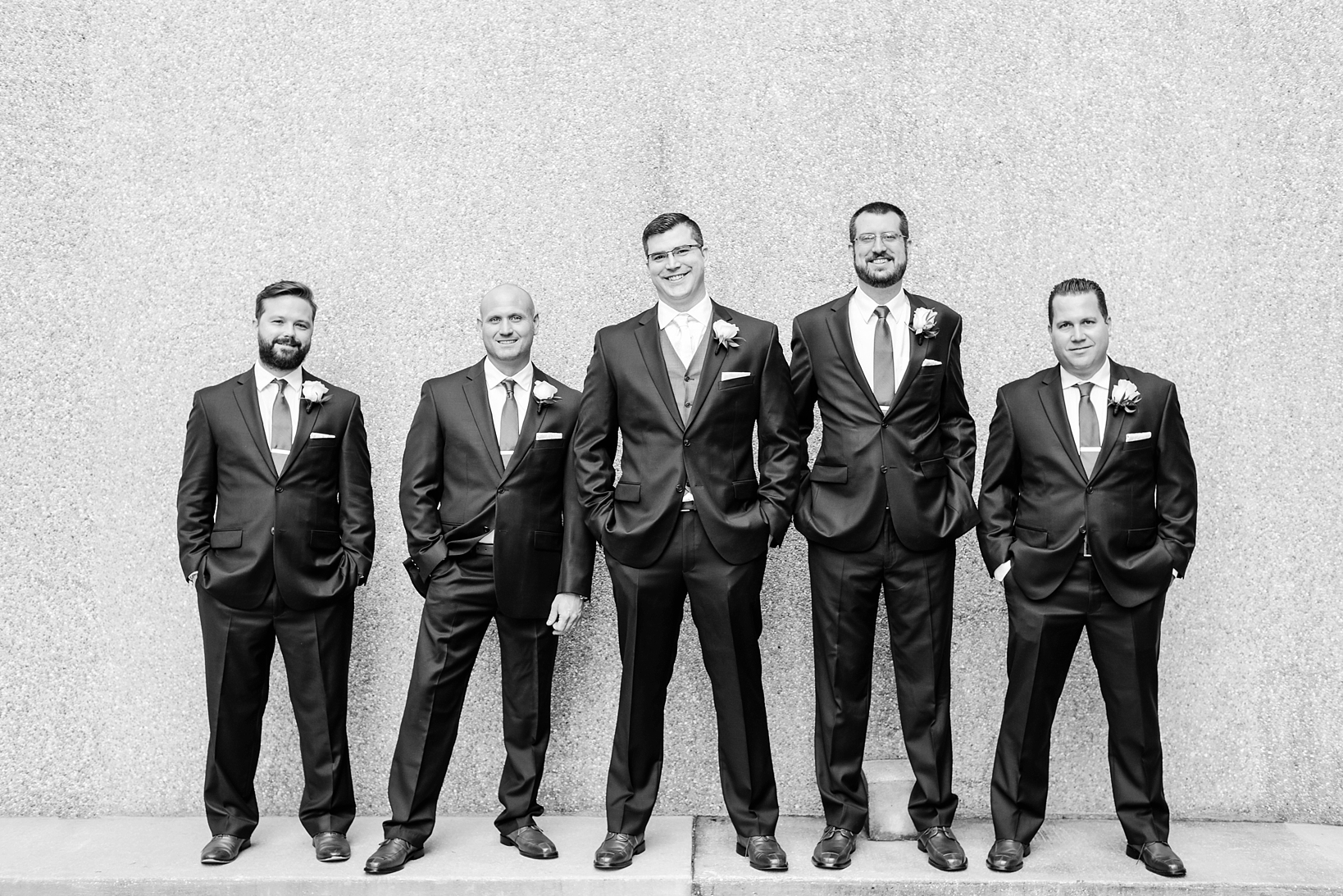 Black and white image of the groom and his groomsmen by Sarah & Ben Photography
