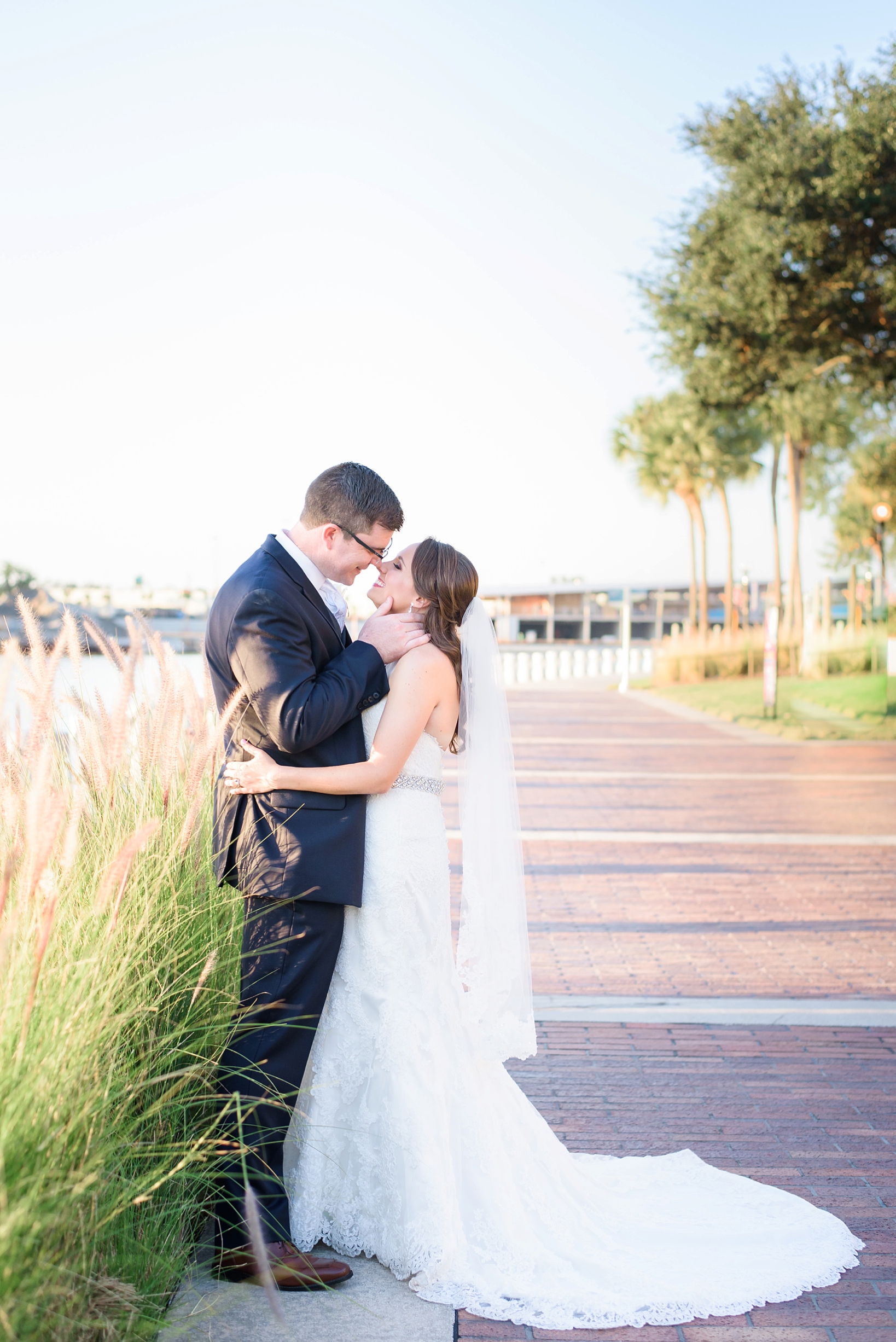 The Bride and Groom almost kissing outside teh Straz Center in Tampa, FL by Sarah & Ben Photography