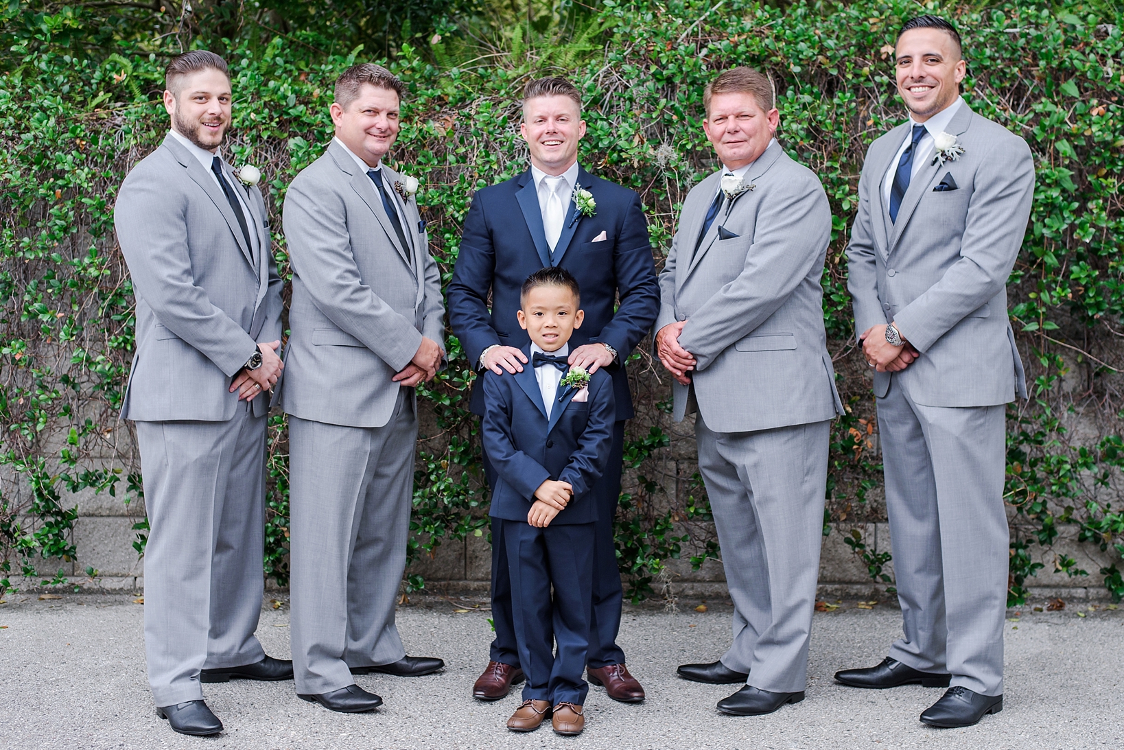 Groom and his son with Groomsmen at a wedding at the T. Pepin Hospitality Centre in Tampa, FL