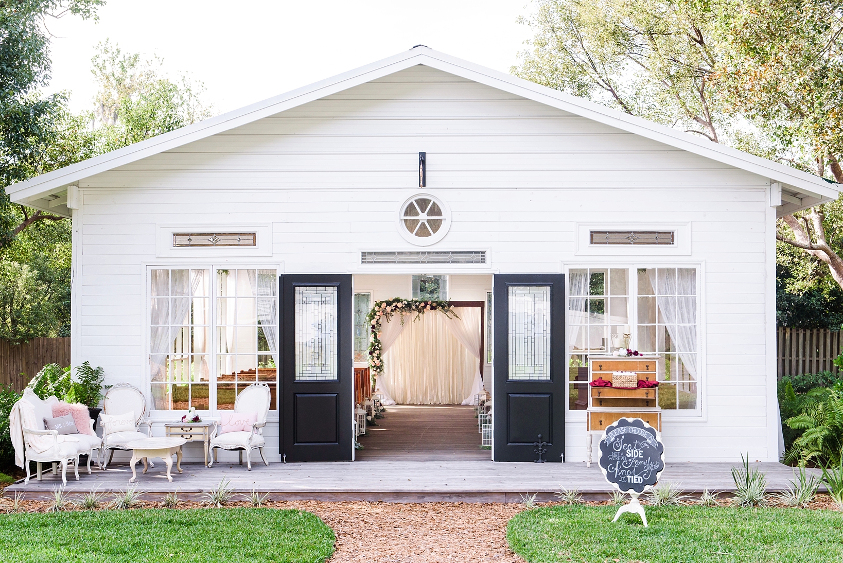 The open air chapel at Cross Creek Ranch with wedding arch through the front door