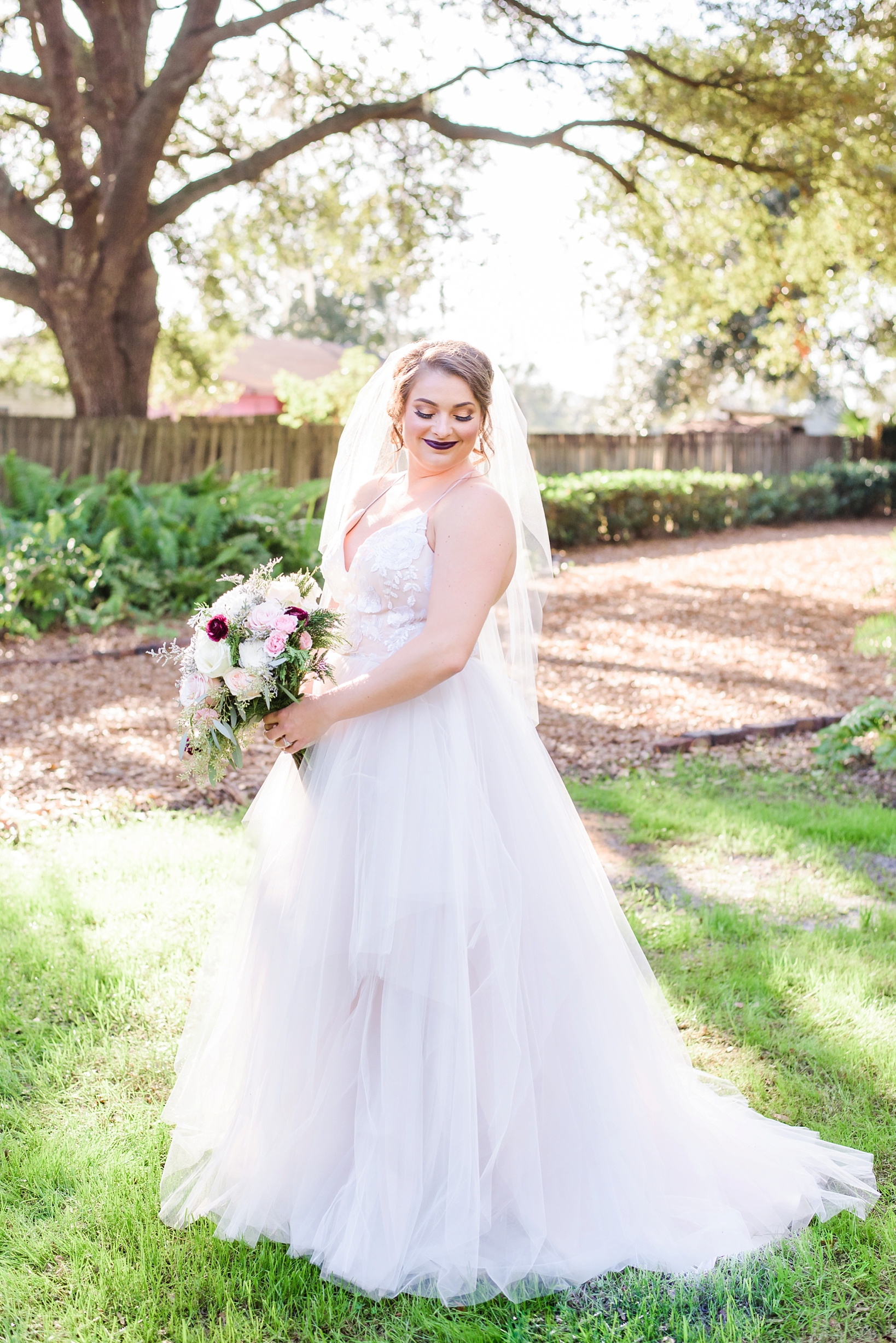 Bride in a flowing Hayley Paige Gown in a rustic setting
