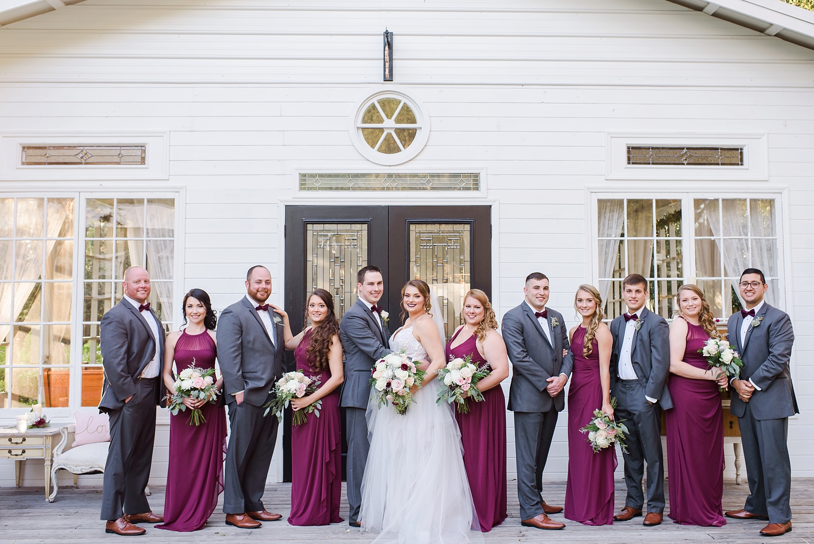 Full bridal party on the front porch of the open air chapel in Seffner ,Fl by Sarah & Ben Photography
