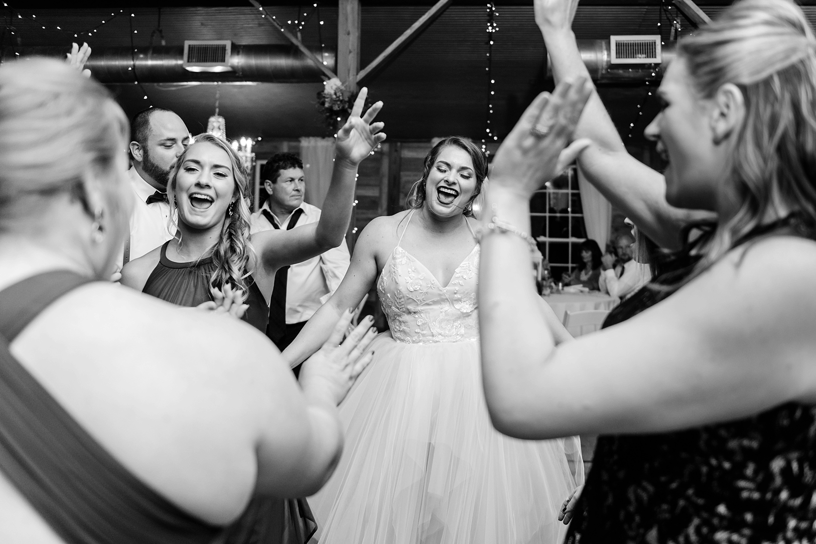 Bride having a genuine moment on the dance floor with her guests