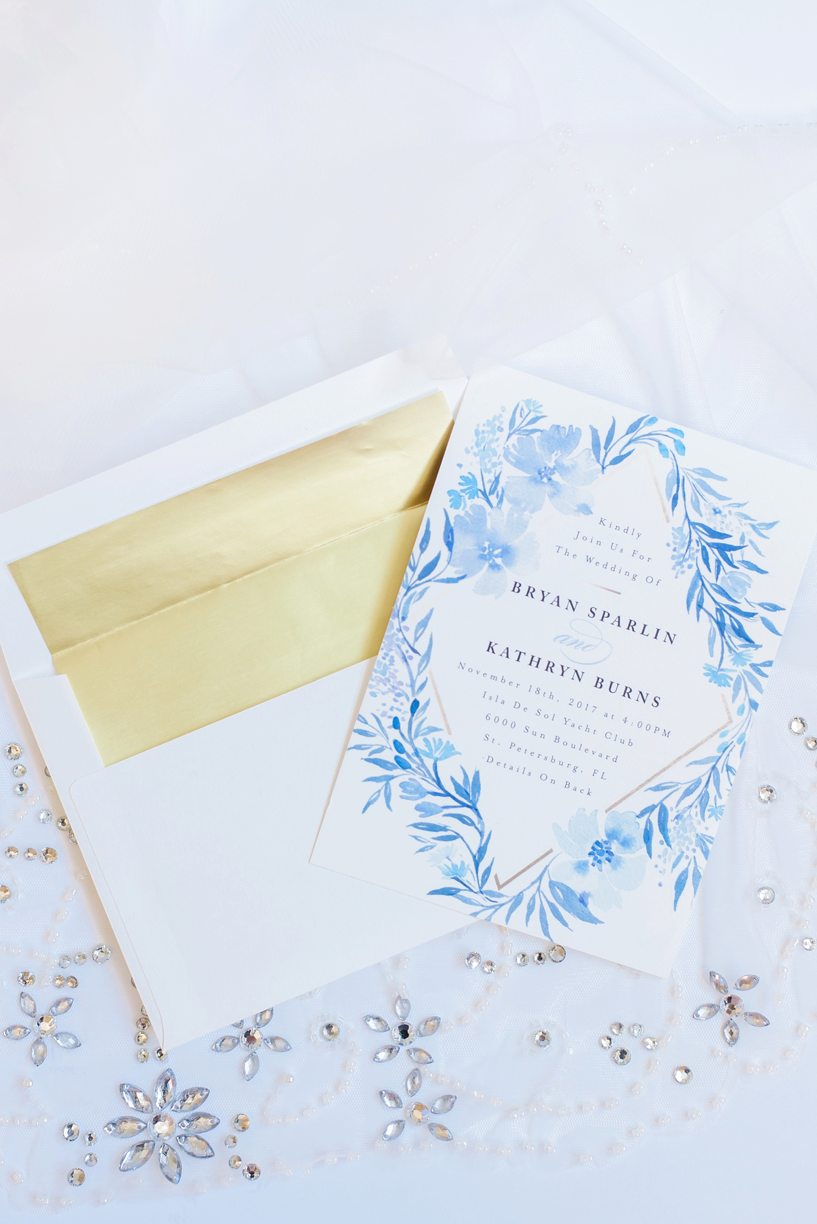 Wedding invitation and envelope on the wedding dress