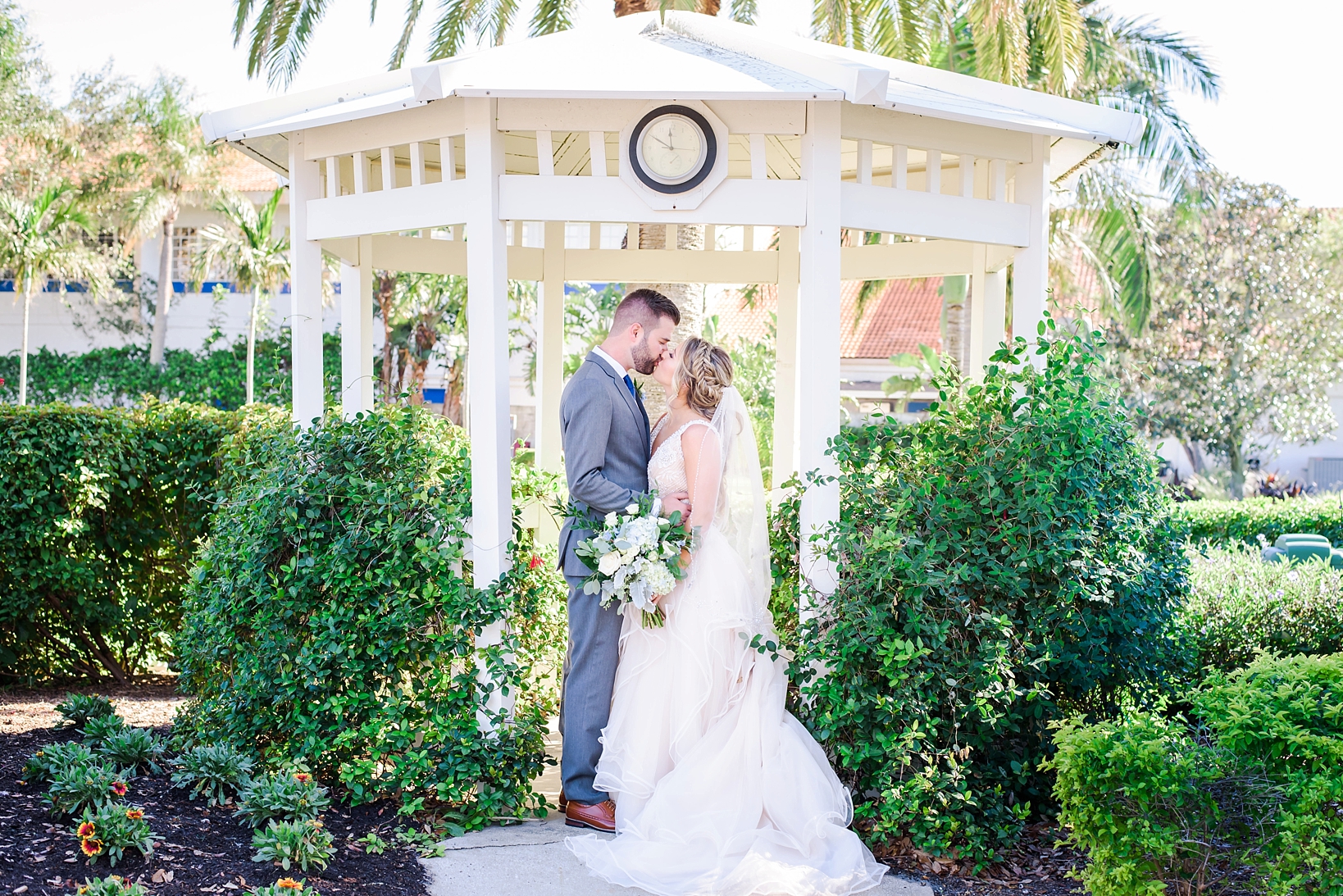 Bride and Groom kiss under a gazebo in St. Pete, FL