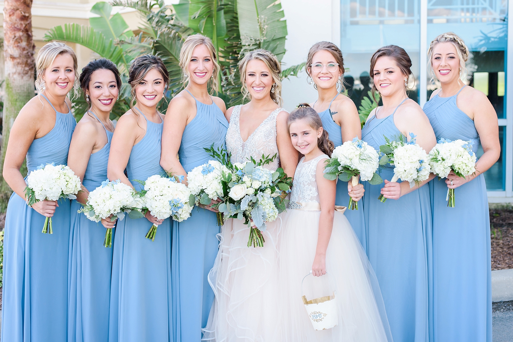 Bride and Her Bridesmaids stand in a formal portrait by Sarah & Ben Photography