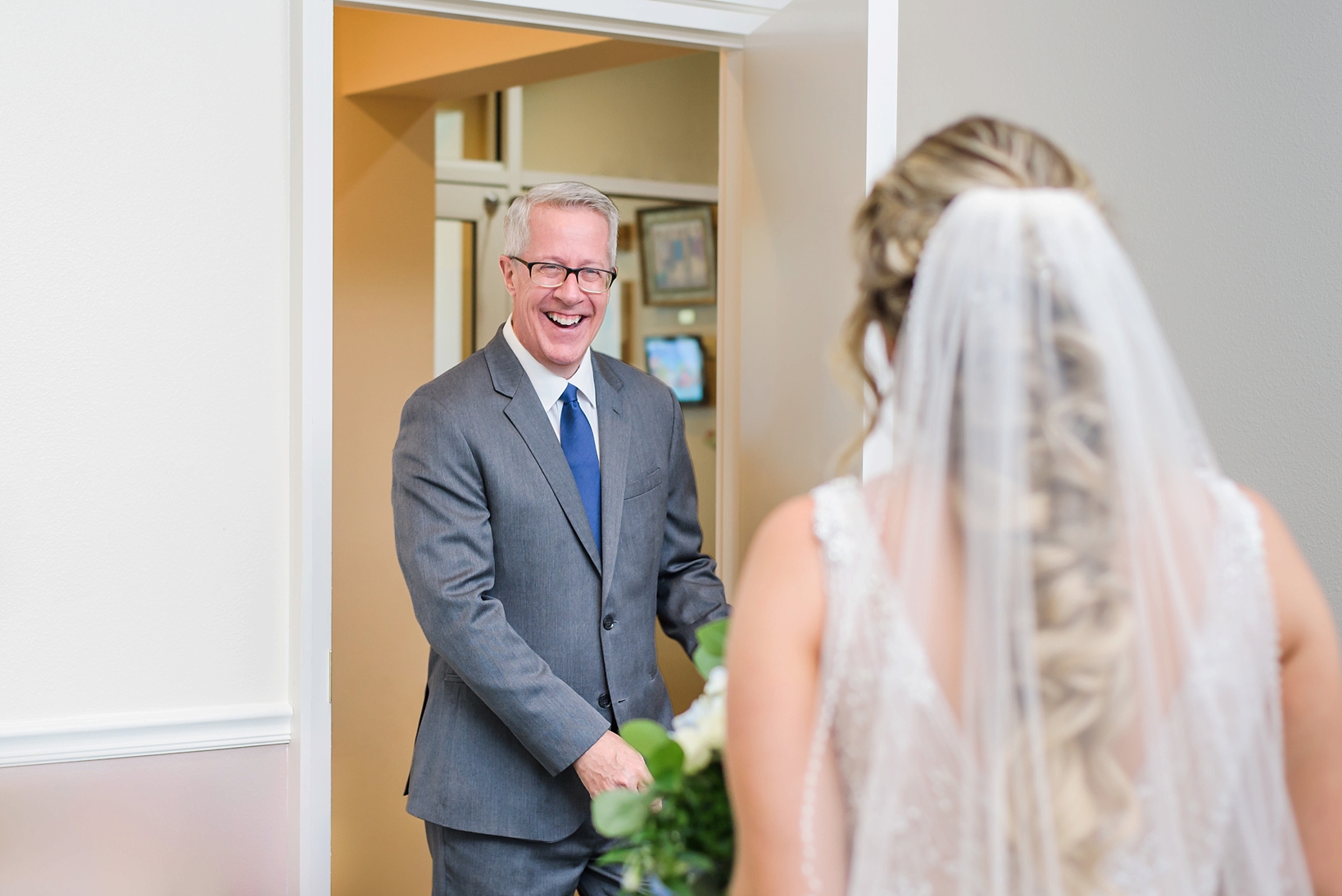 Father seeing his daughter in her wedding dress for the first time by Sarah & Ben Photography