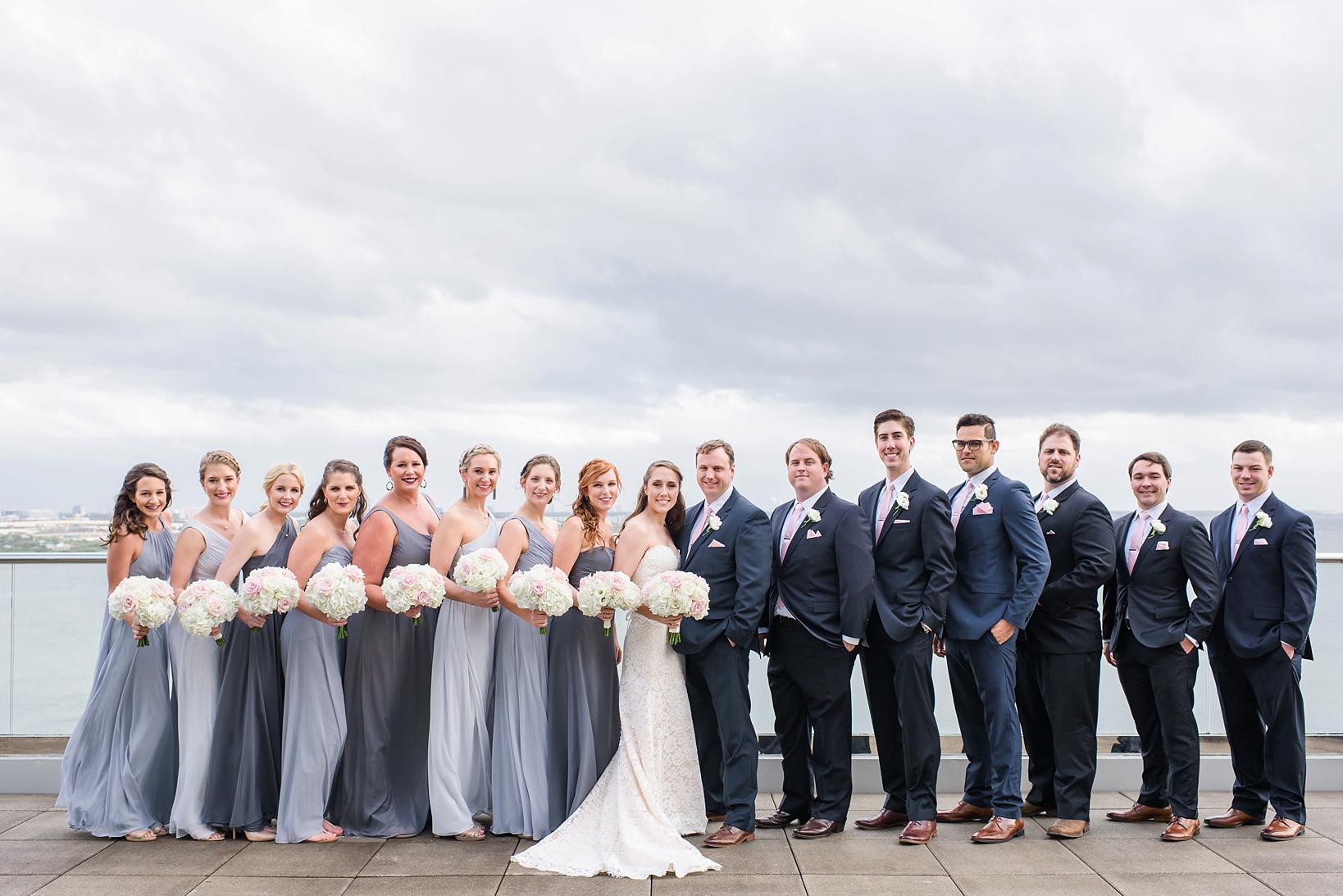 The complete bridal party on the rooftop deck of the Westin Tampa Bay hotel by Sarah & Ben Photography