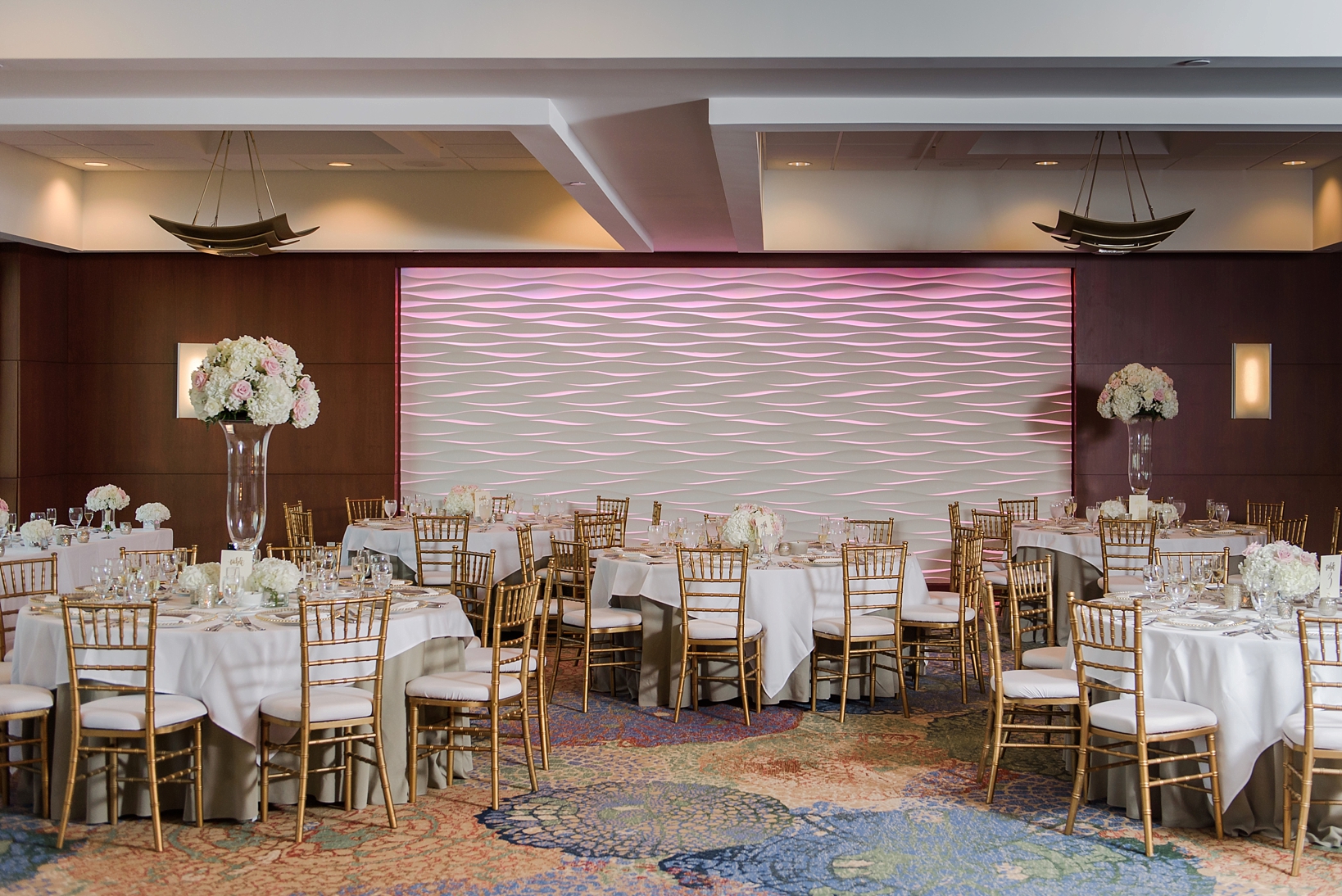Reception space at the westin Tampa bay with a mix of high and low floral centerpices by Sarah & Ben Photography
