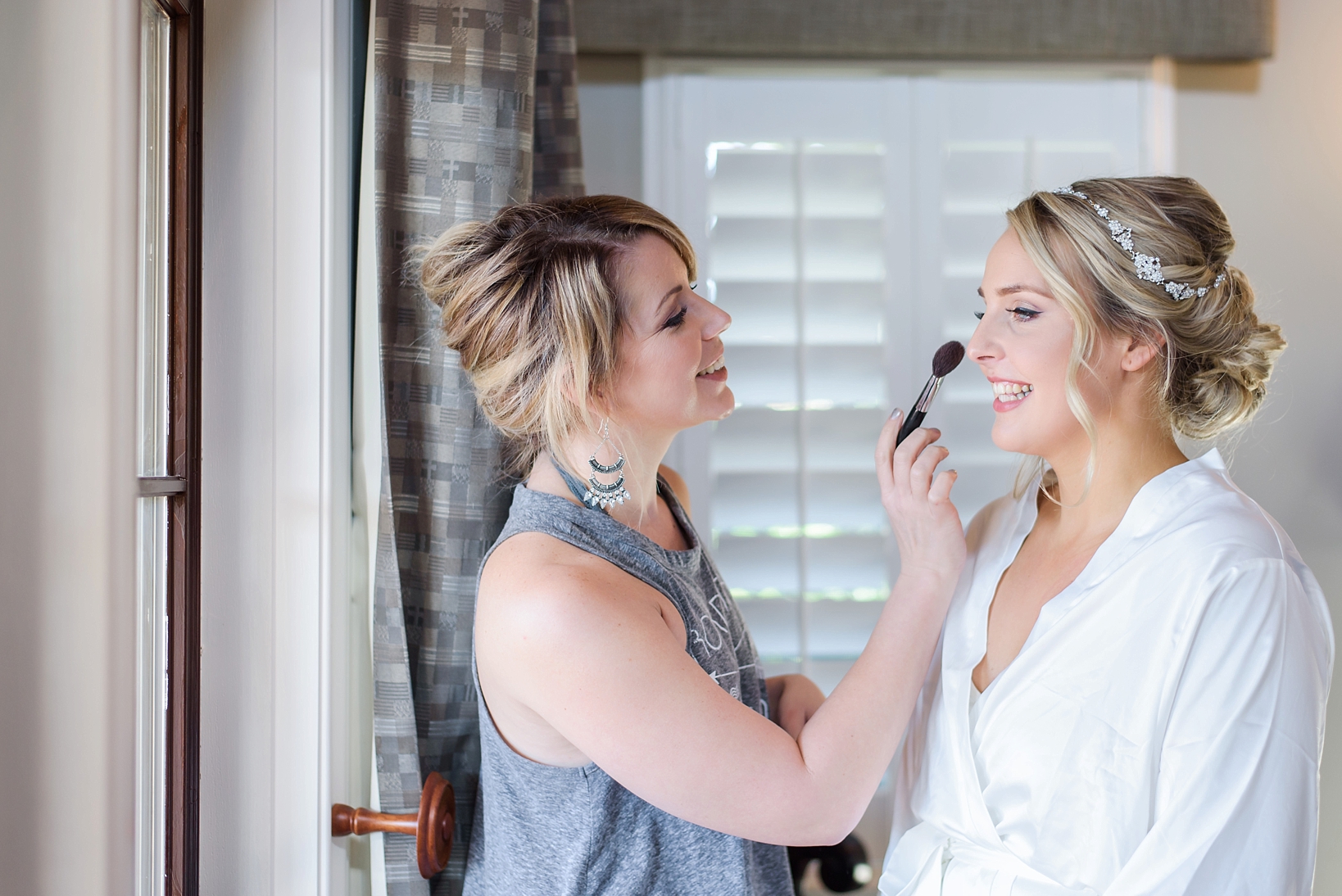 Bride getting her finishing touches of makeup