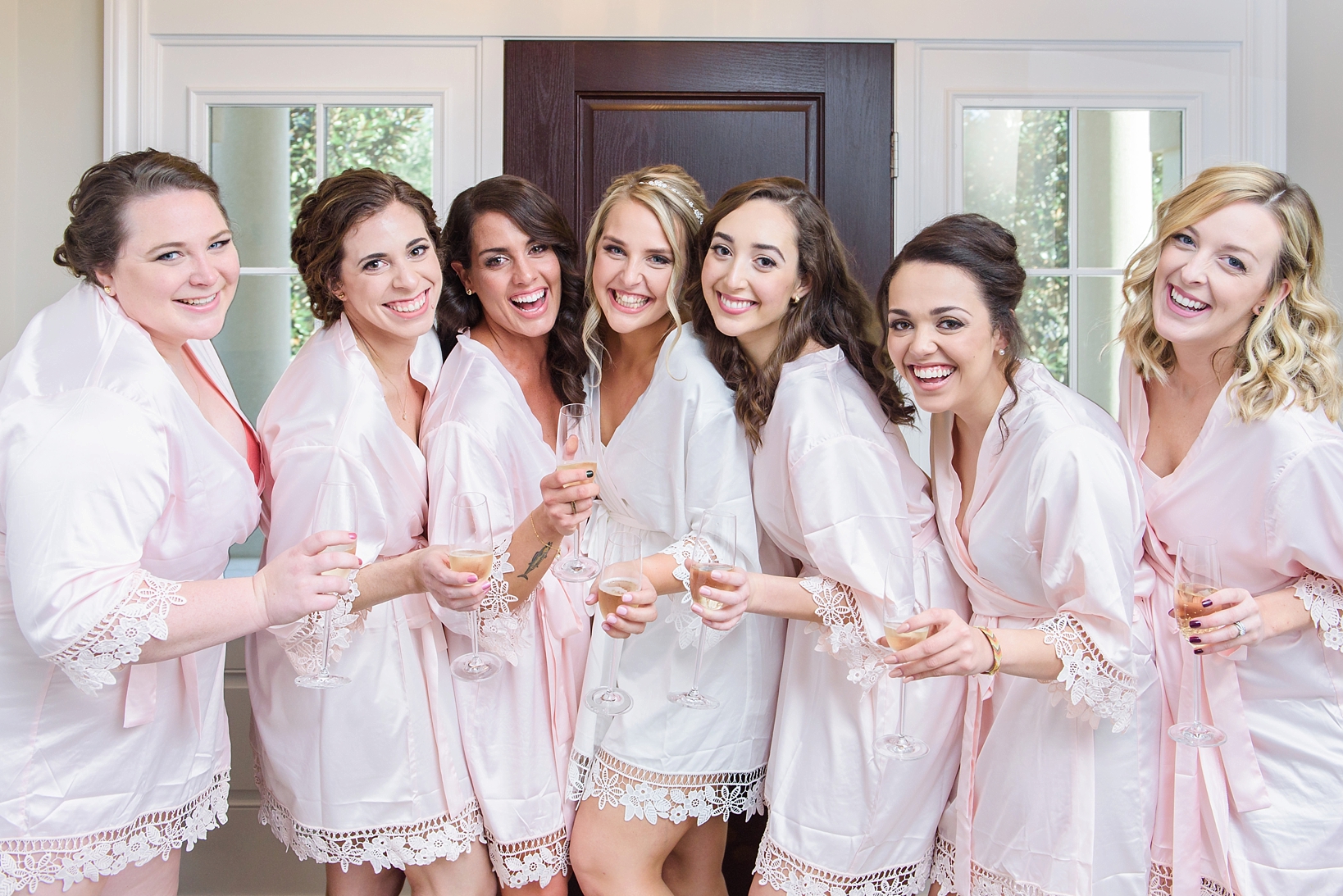 Bride and her bridesmaids in matching silk robes
