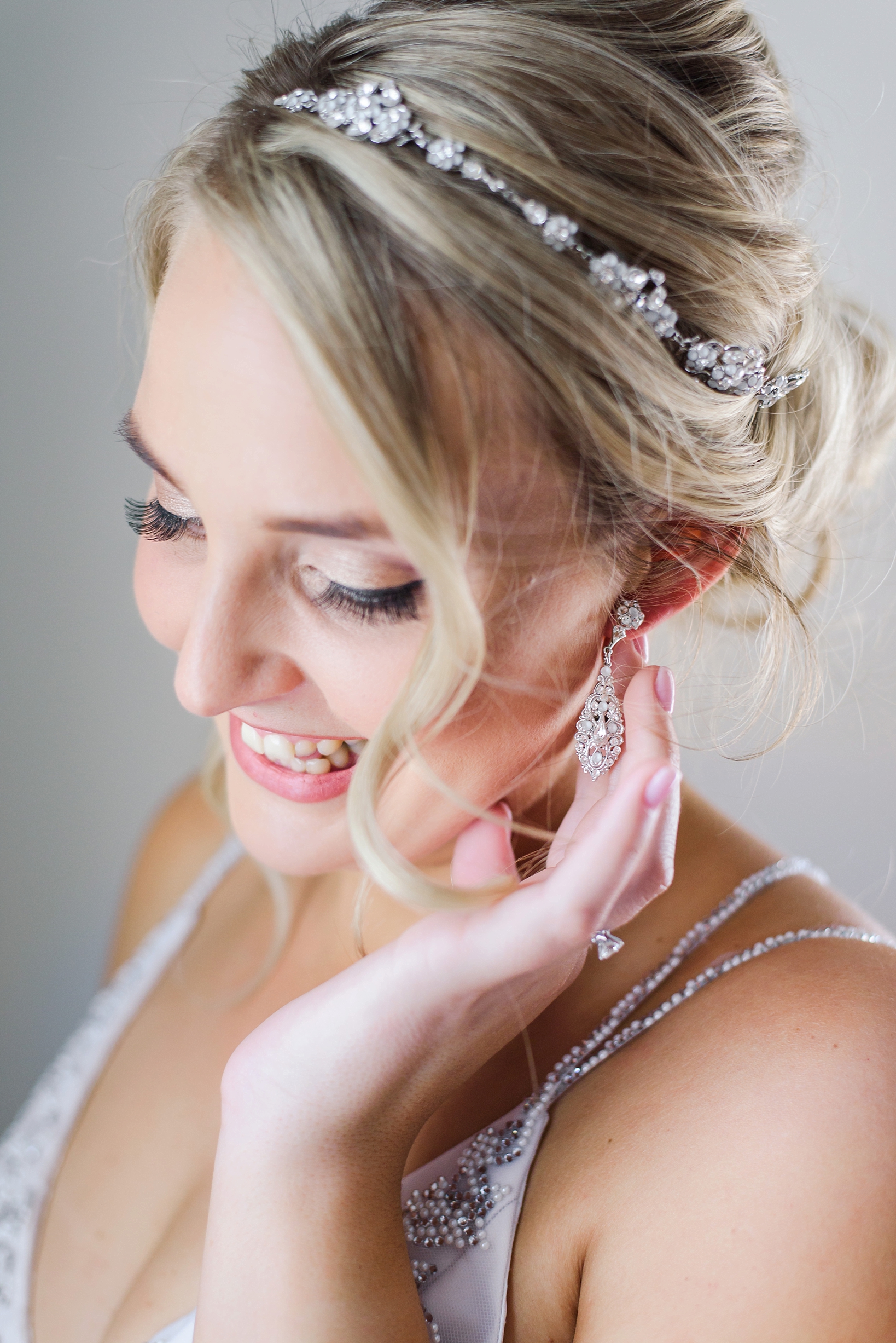 Bride with her diamond headband and matching earrings