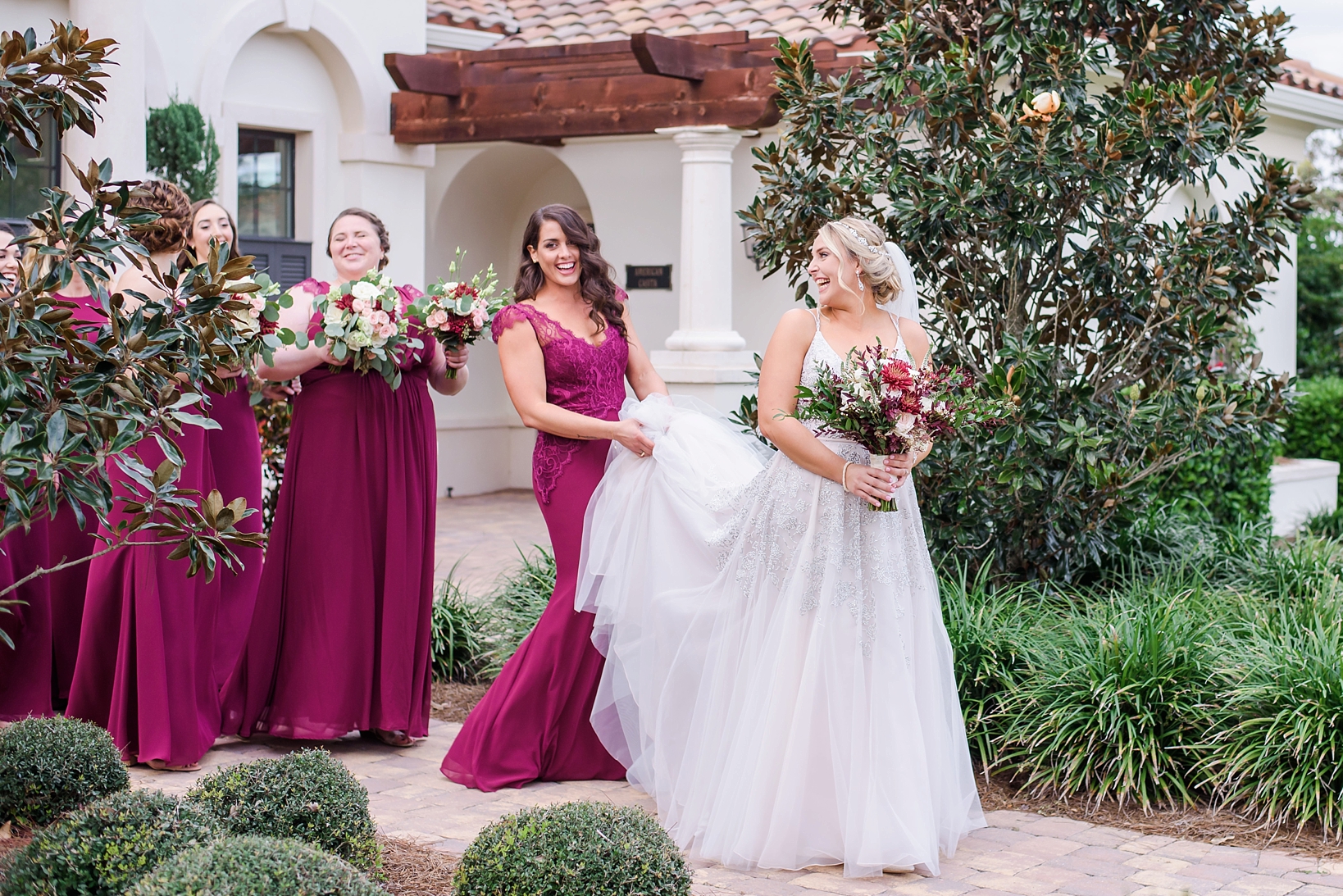 A candid moment between the Bride and Her Bridesmaids as they walk to the Ceremony