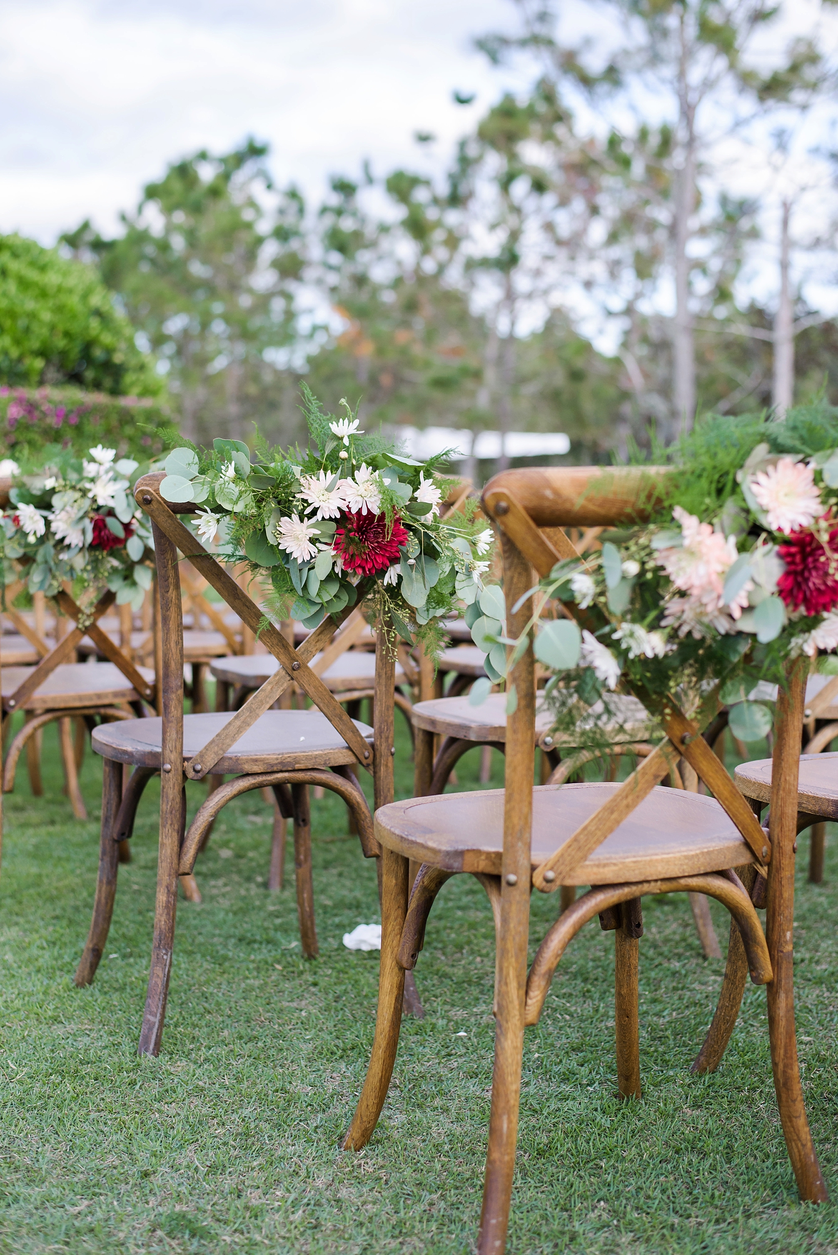 Rustic chairs with floral decor aisle runners