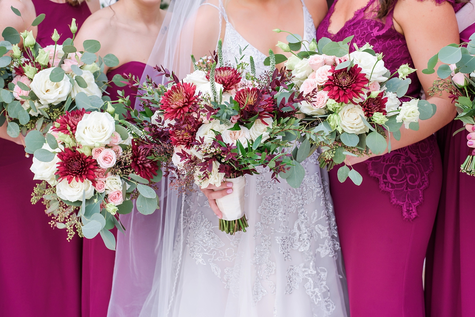 The Bride and Bridesmaid's flowers with pops of red and white