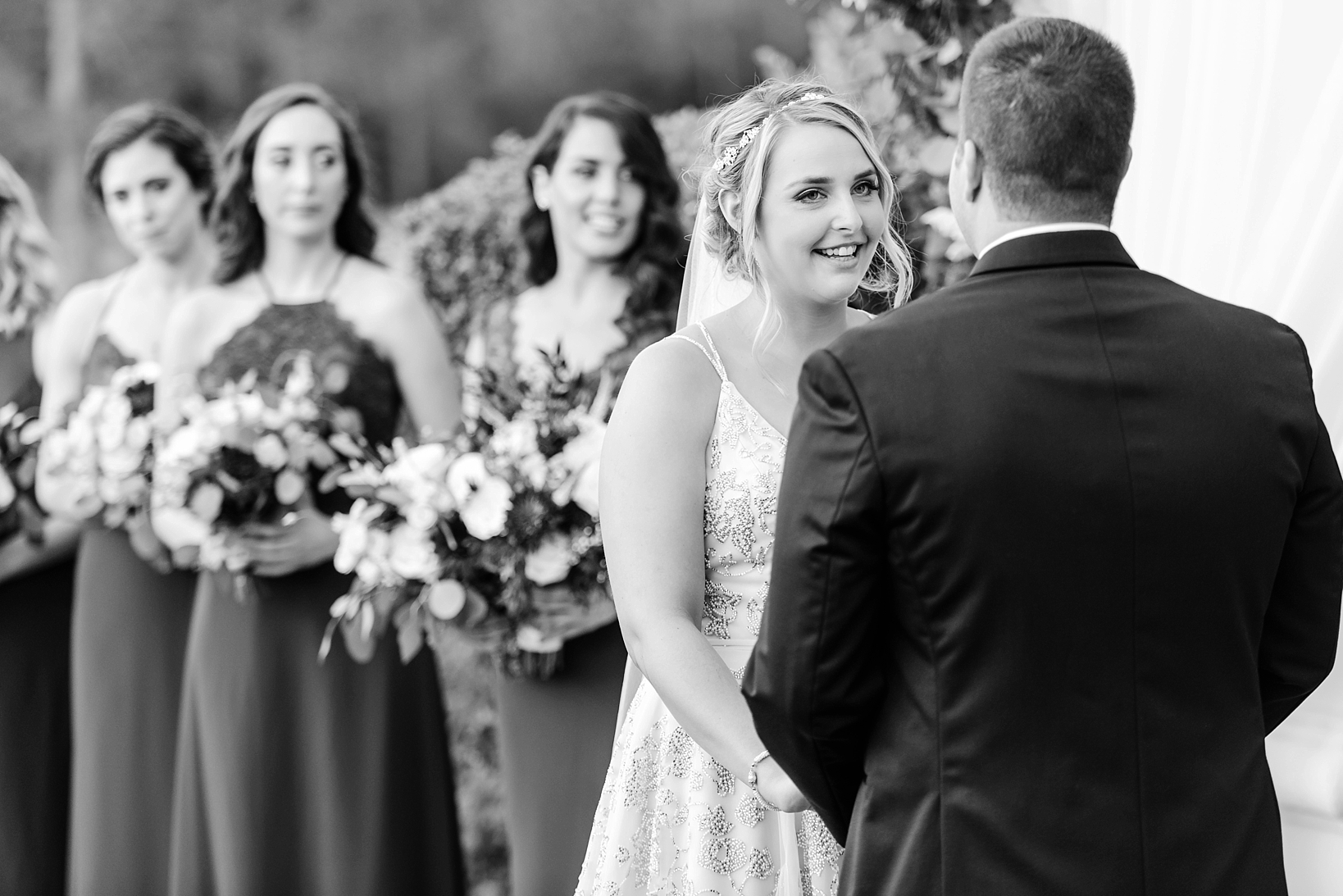 Black and White image of the Bride giving her vows during the ceremony by Sarah & Ben Photography