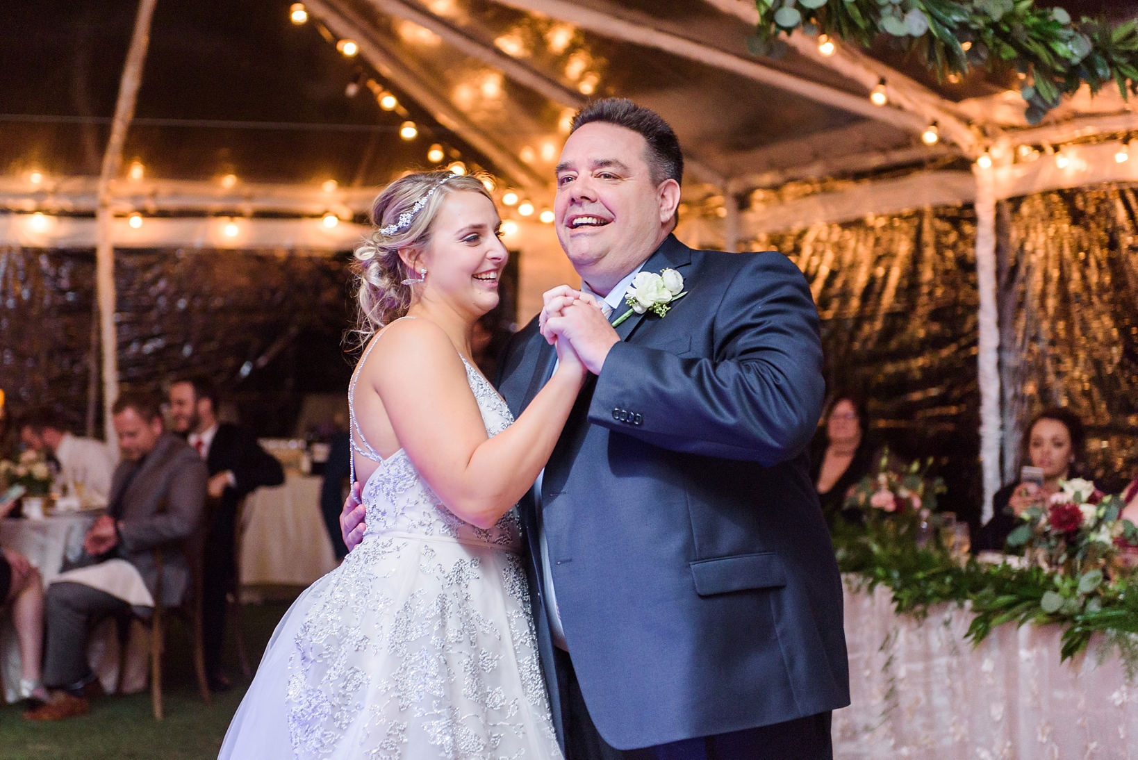 Father and Daughter dance under the tent
